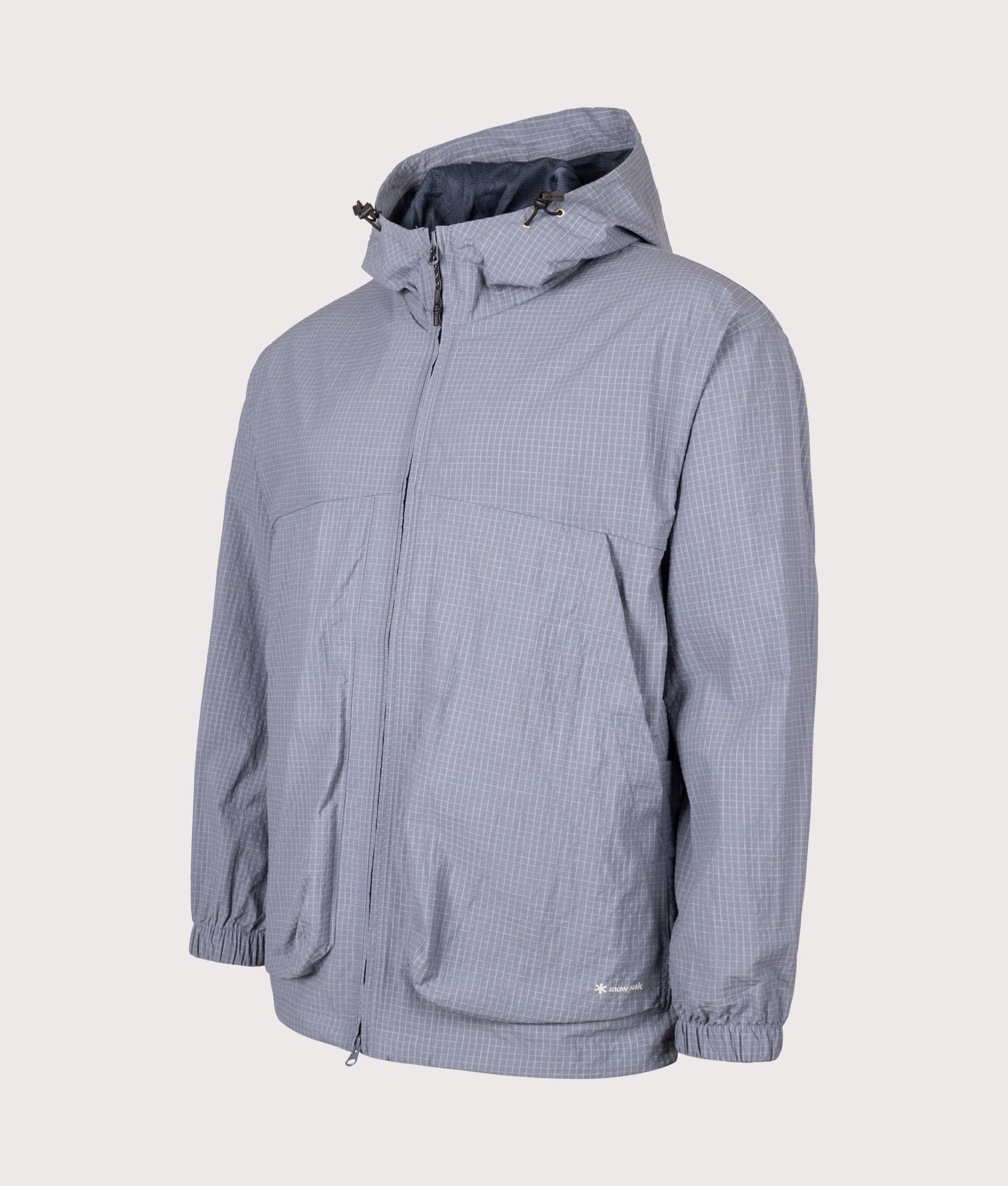 Snow Peak KASURI Ripstop Jacket in Light Blue at EQVVS Menswear. Angled front shot.