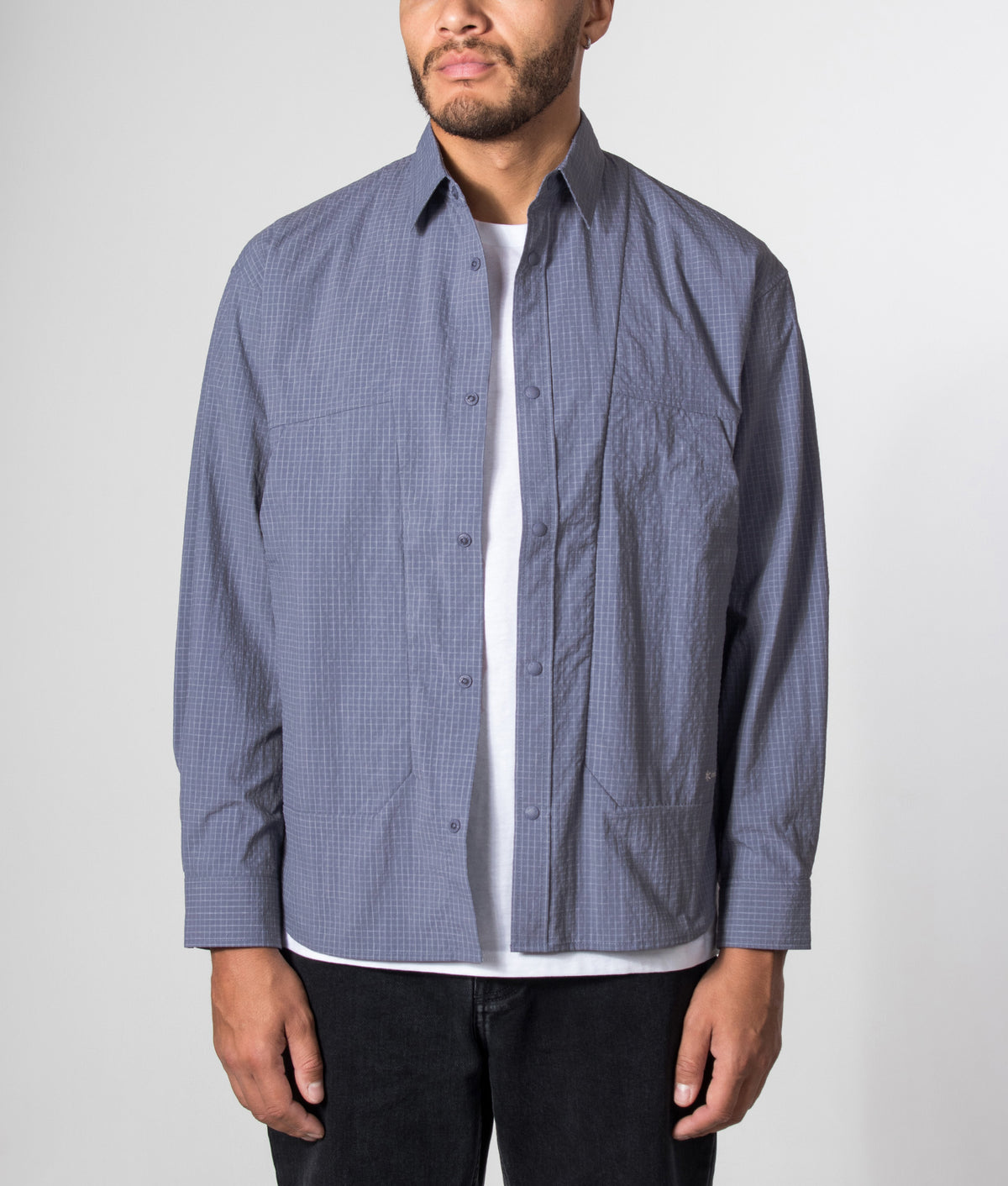 Snow Peak Relaxed Fit KASURI Ripstop Shirt in Light Blue at EQVVS Menswear. Model front shot.