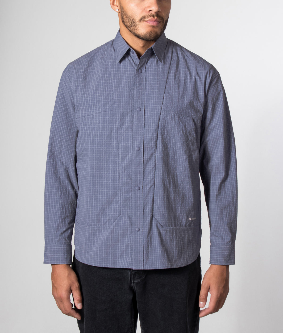 Snow Peak Relaxed Fit KASURI Ripstop Shirt in Light Blue at EQVVS Menswear. Model front shot.