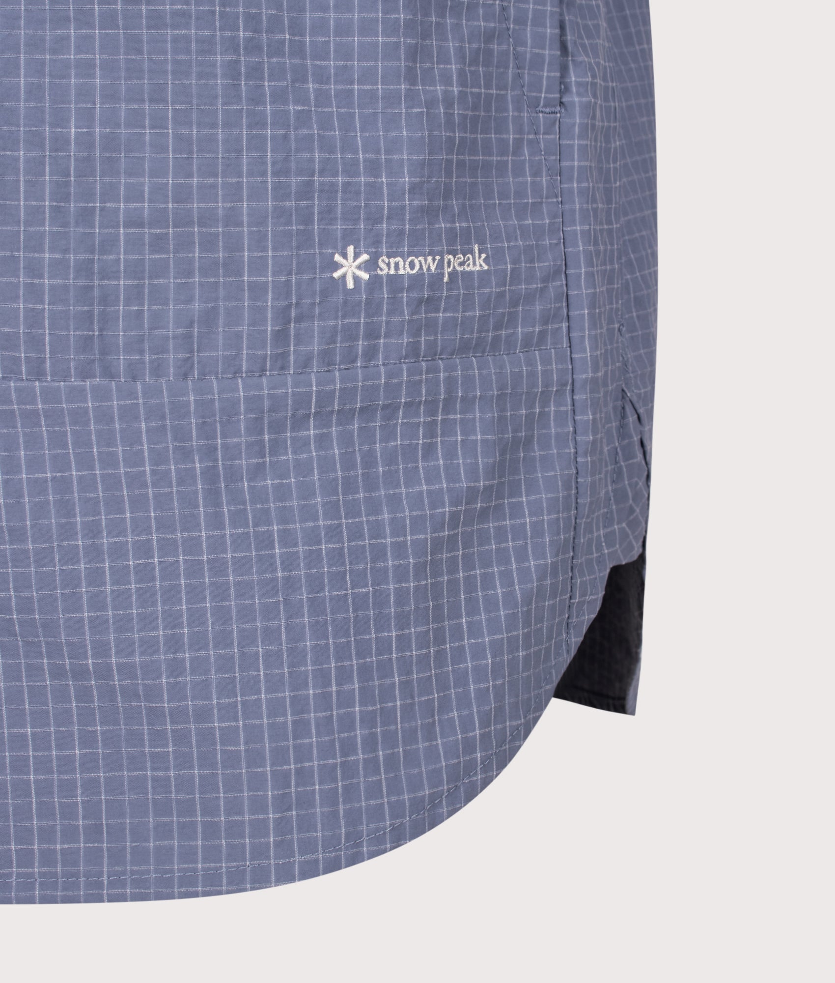 Snow Peak Relaxed Fit KASURI Ripstop Shirt in Light Blue at EQVVS Menswear. Detail shot.