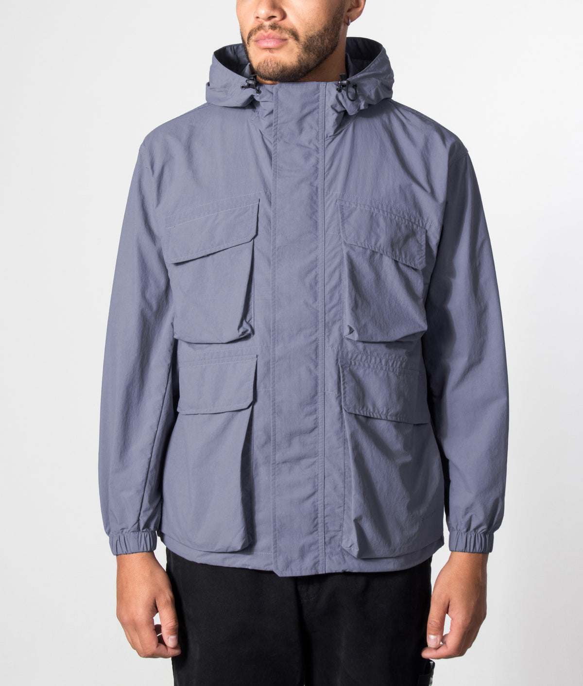Snow Peak Regular Fit Nylon Double Rip Jacket in Light Blue at EQVVS Menswear. Model front shot.
