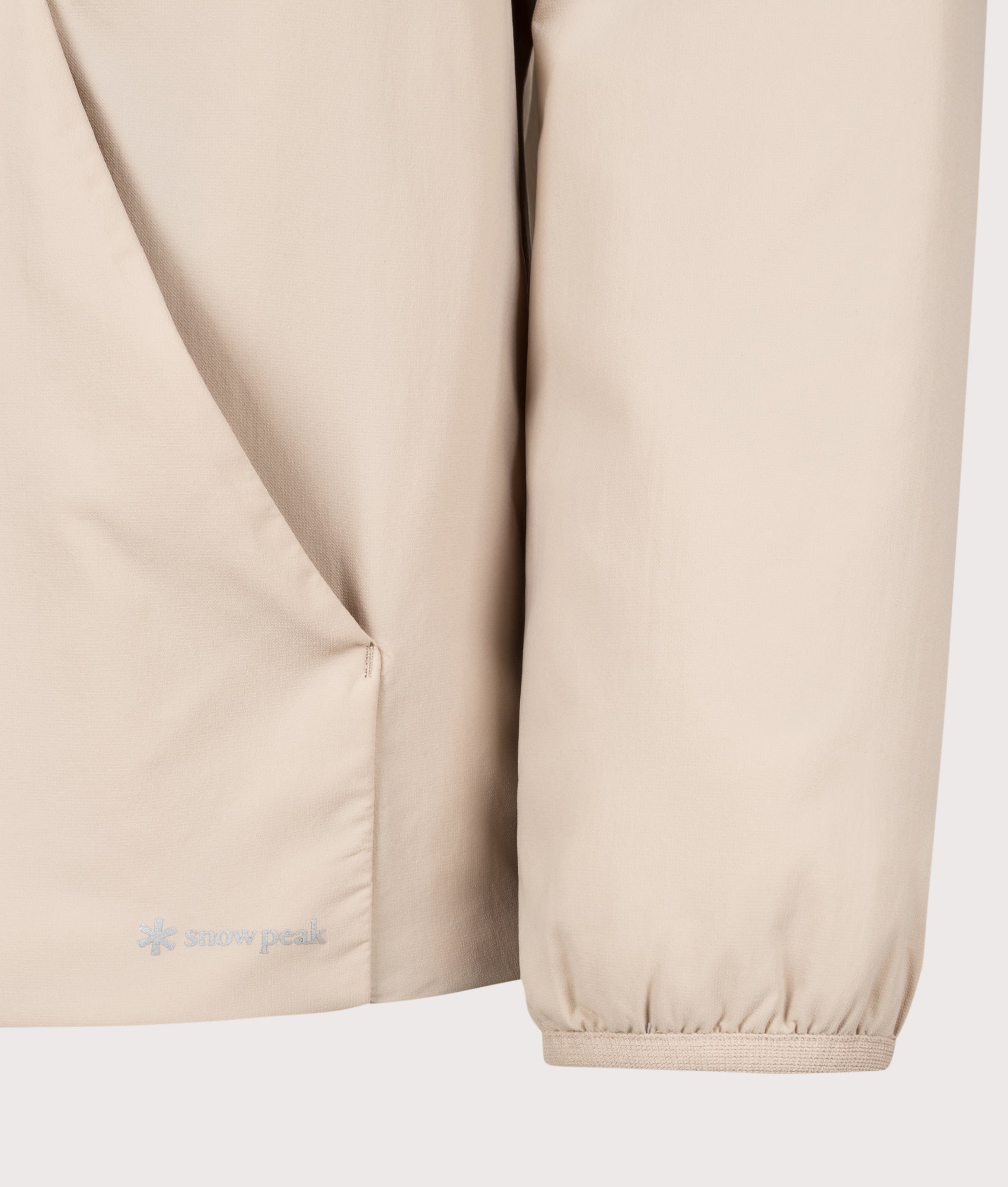 Snow Peak Regular Fit Flexible Insulated Zip Parka in Light Brown at EQVVS Menswear. Detail shot.