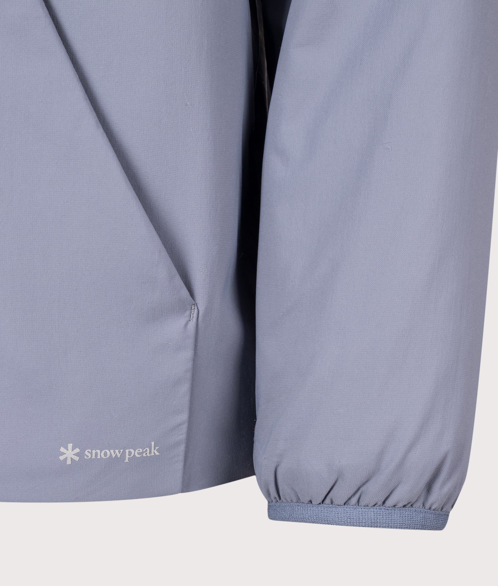 Snow Peak Regular Fit Flexible Insulated Zip Parka in Light Blue at EQVVS Menswear. Detail shot.