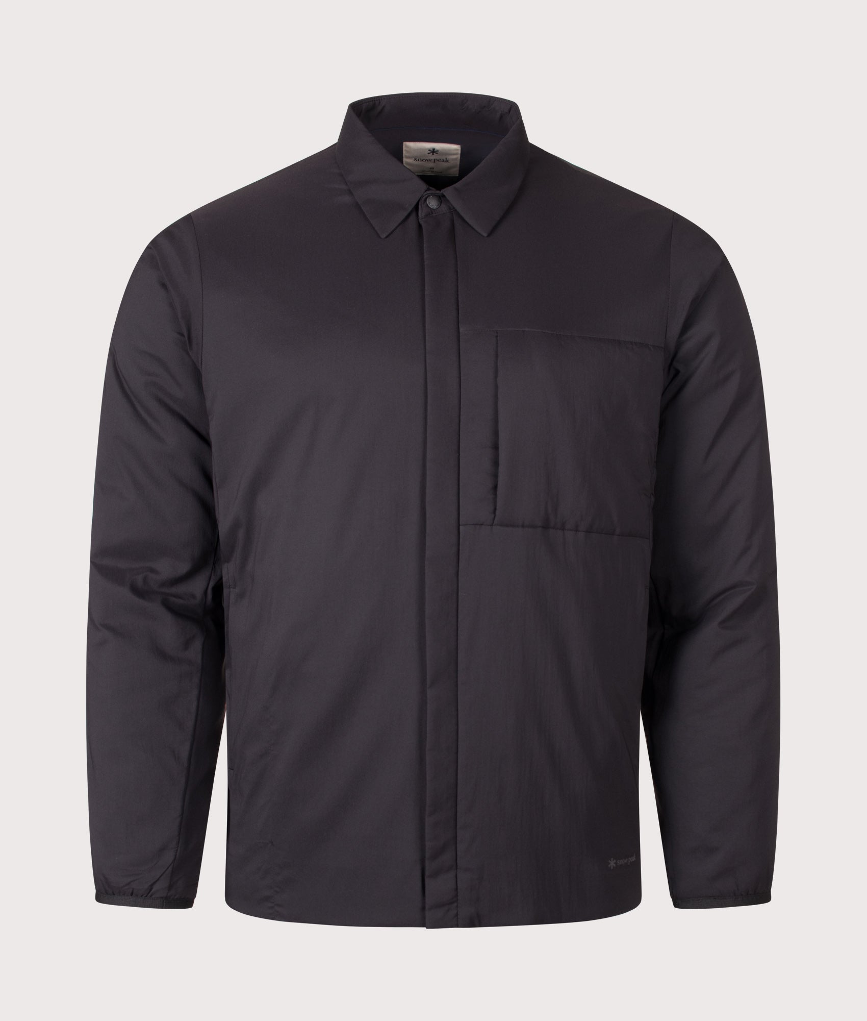 Snow Peak Regular Fit Flexible Insulated Shirt in Black at EQVVS Menswear. Front shot.