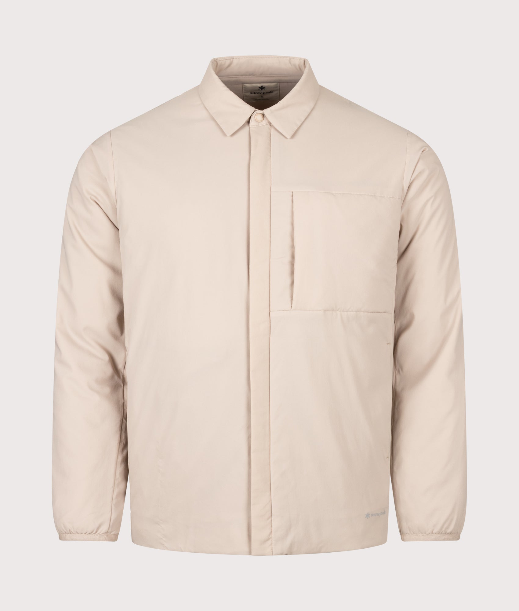 Snow Peak Regular Fit Flexible Insulated Shirt in Light Brown at EQVVS Menswear. Front shot.