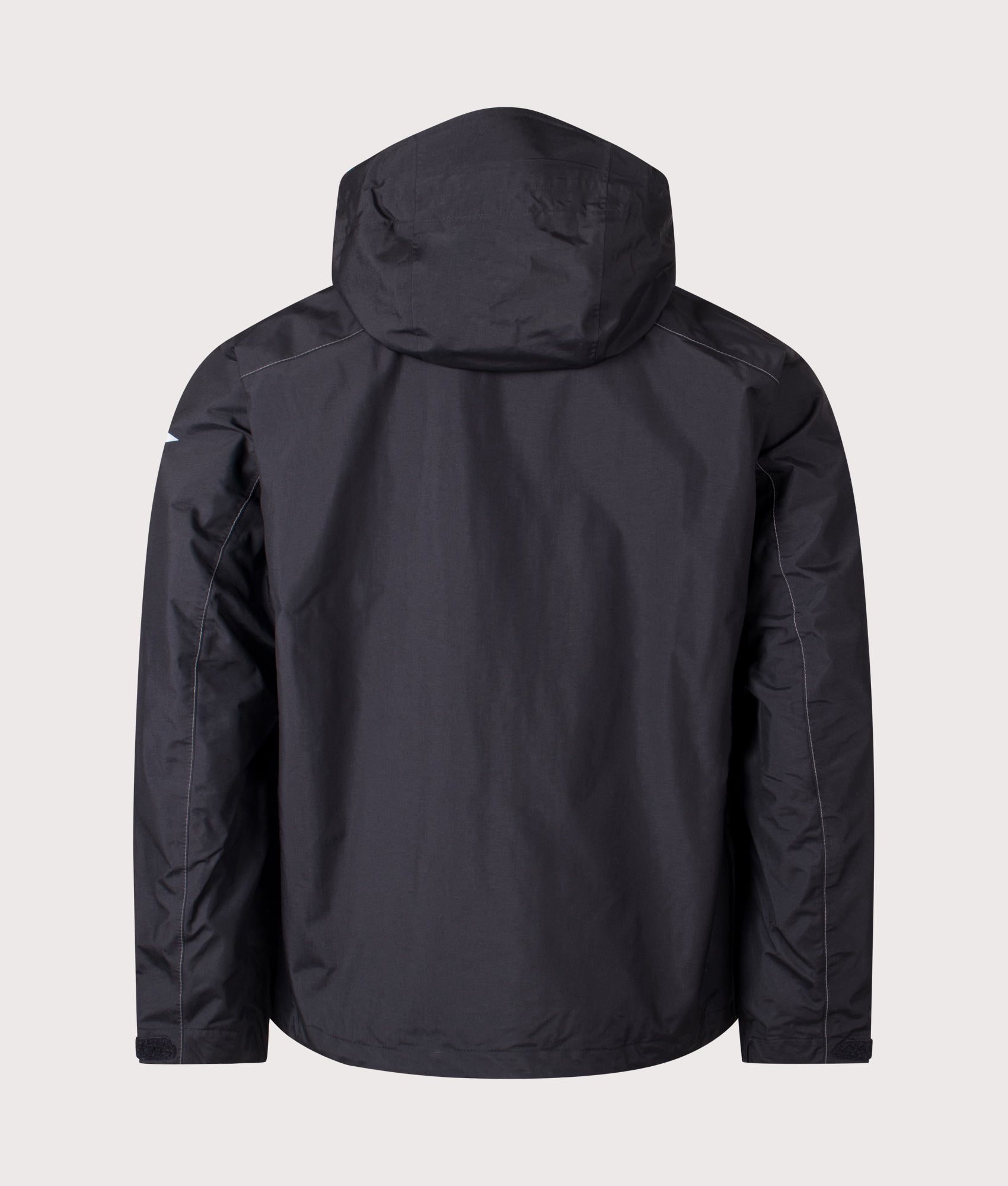 And Wander 2.5L Hiker Rain Jacket in Black at EQVVS Menswear. Back shot.