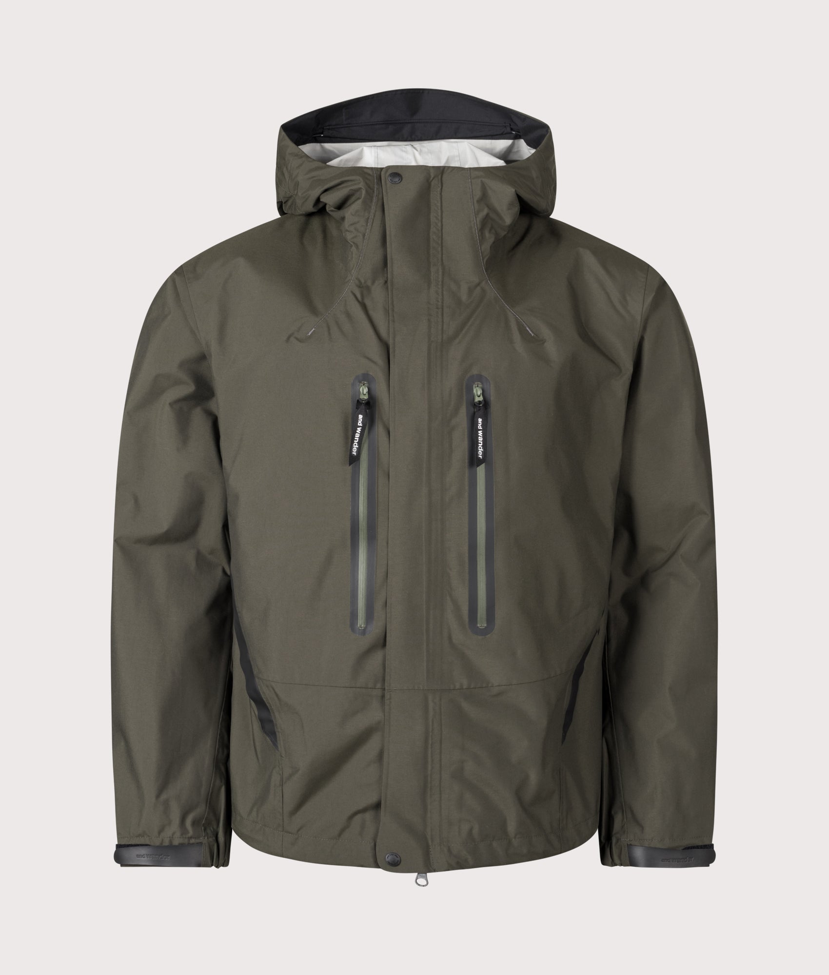 And Wander 2.5L Hiker Rain Jacket in Khaki at EQVVS Menswear. Front shot.