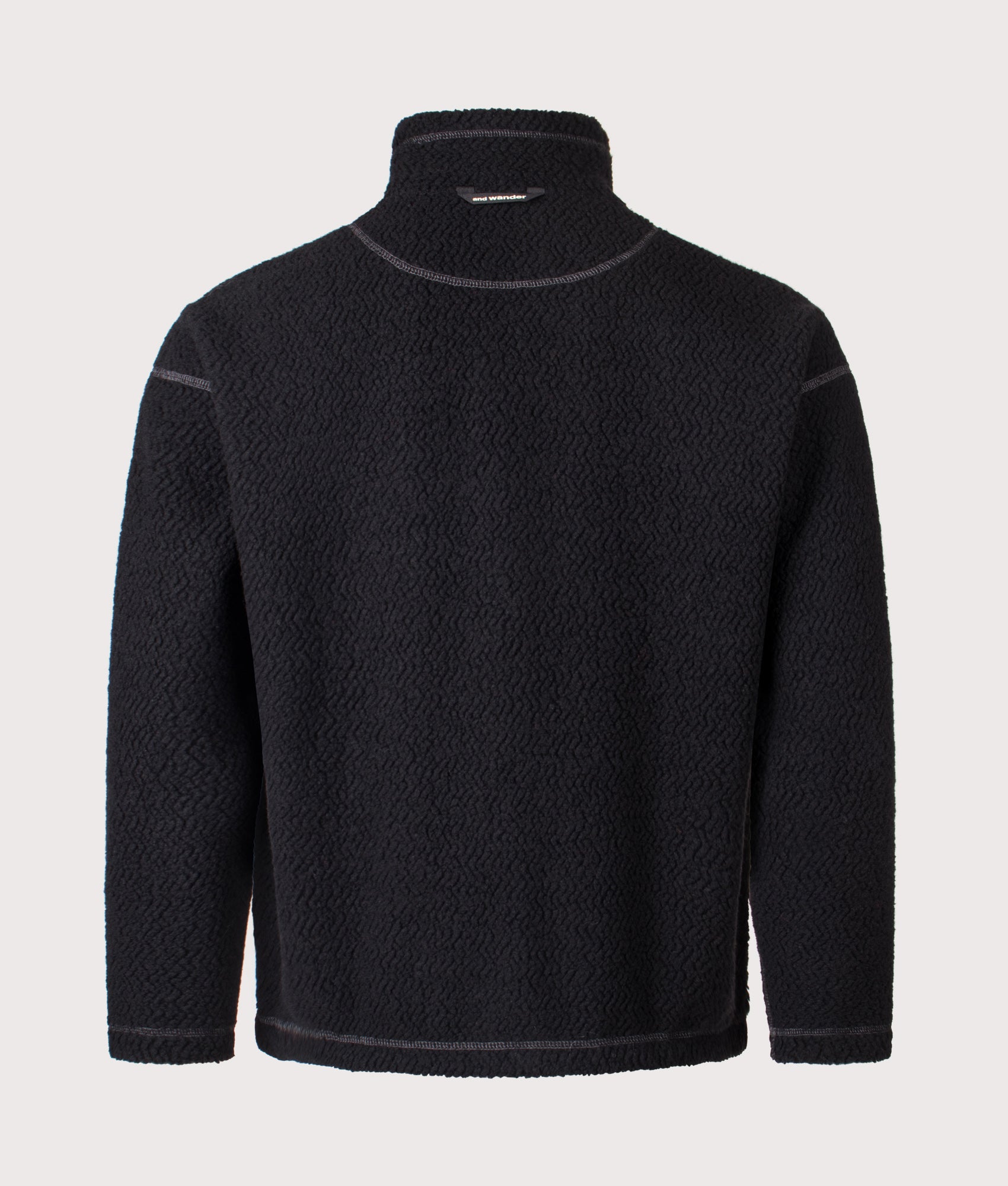 And Wander Re Wool JQ Stand Zip Sweatshirt in black at EQVVS Menswear. Back shot. 