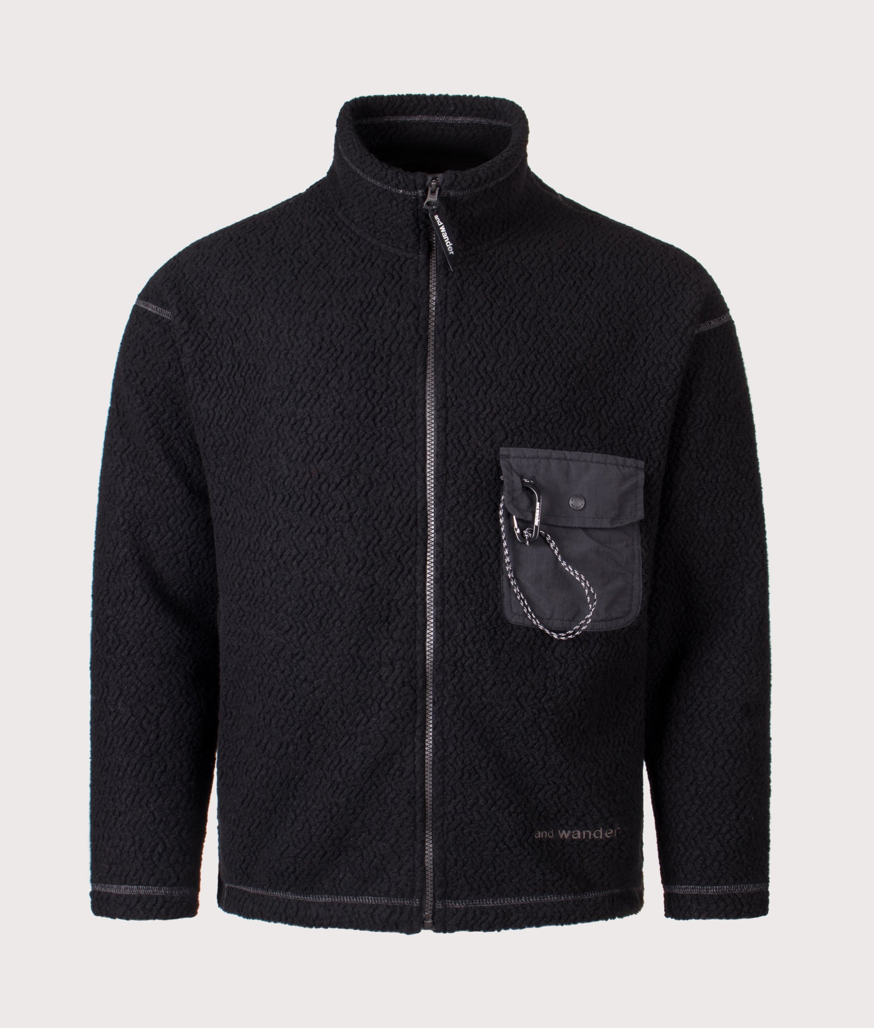 And Wander Re Wool JQ Stand Zip Sweatshirt in black at EQVVS Menswear. Front shot.