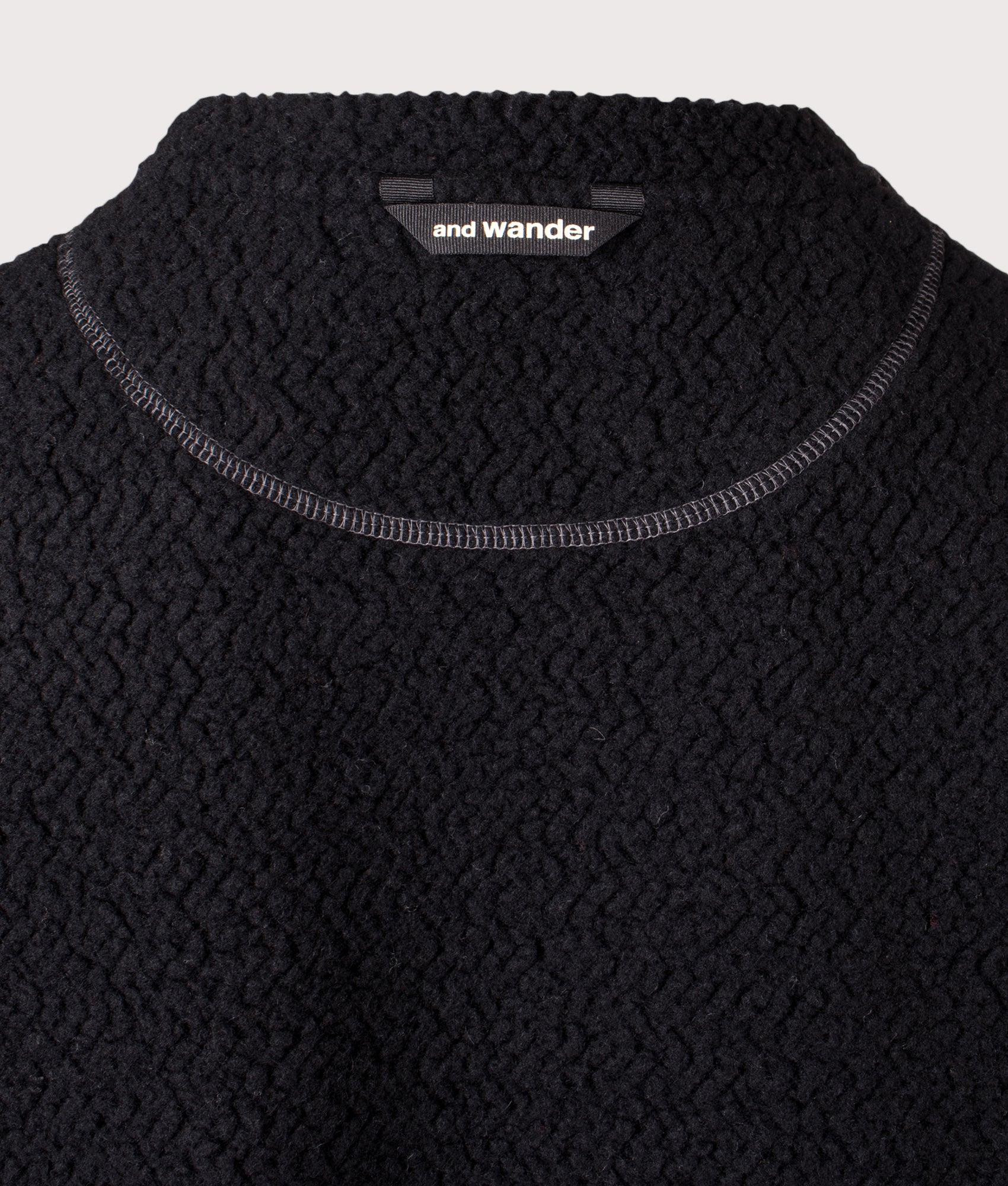 And Wander Re Wool JQ Crew Sweatshirt in Black at EQVVS Menswear. Back detail shot.