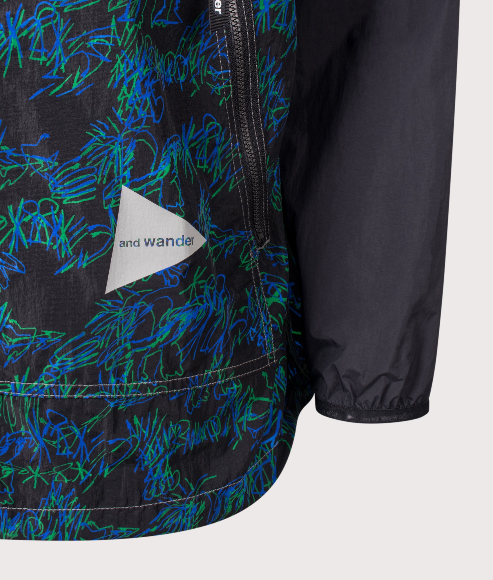 Printed Wind Jacket in Black by and wander. Shot by EQVVS. Detail Front shot.
