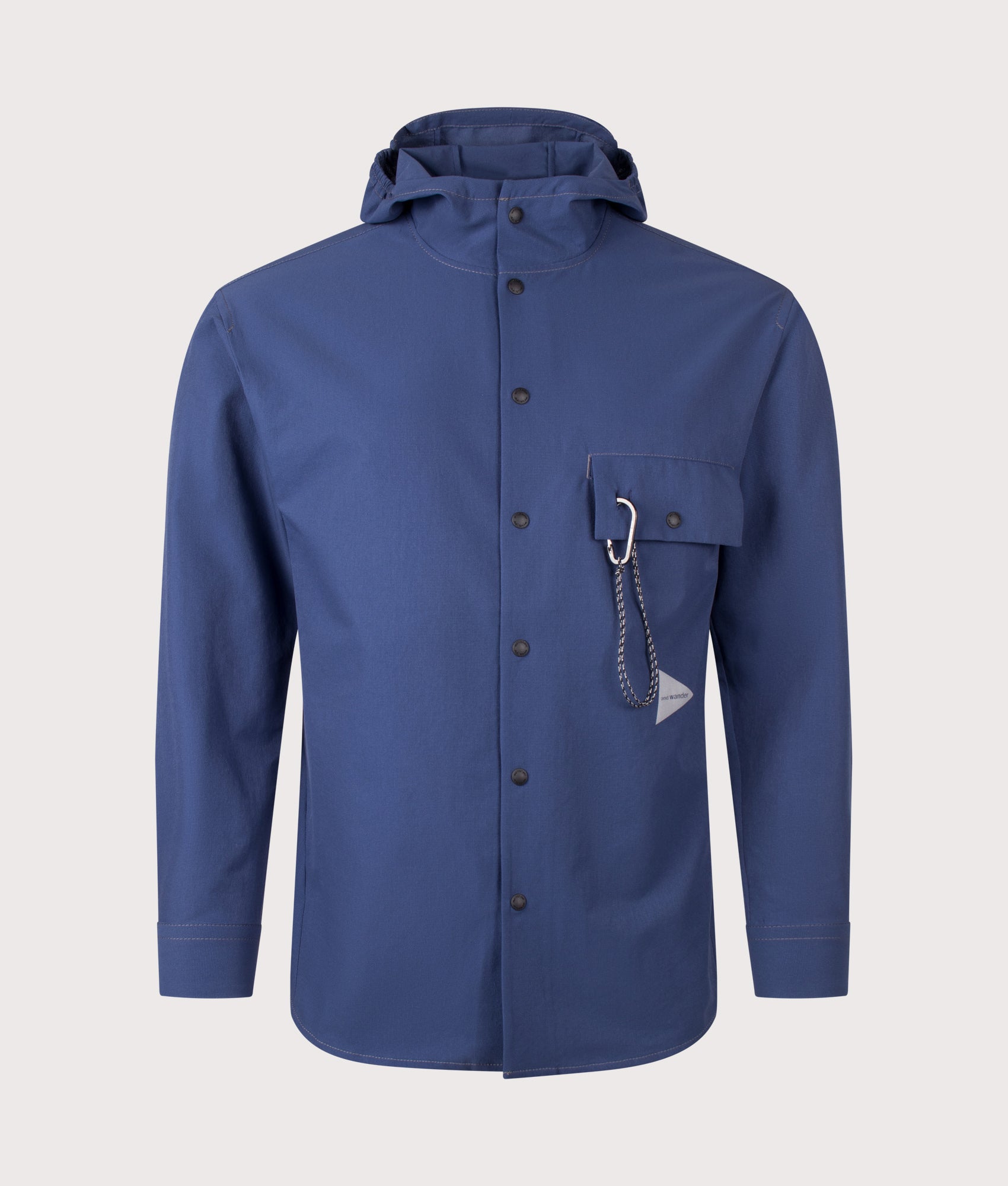 and wander Dry Breathable Hoodie in Blue  at EQVVS Menswear. Front shot.