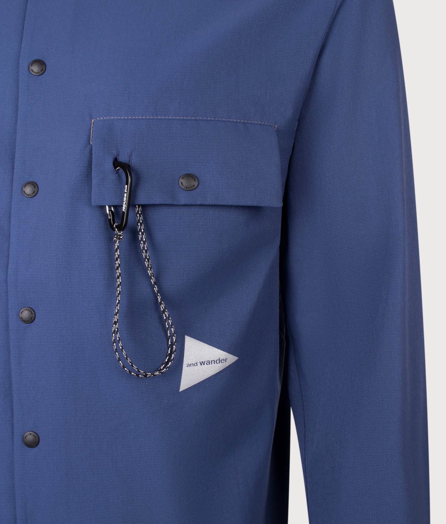 and wander Dry Breathable Hoodie in Blue  at EQVVS Menswear. Front shot.