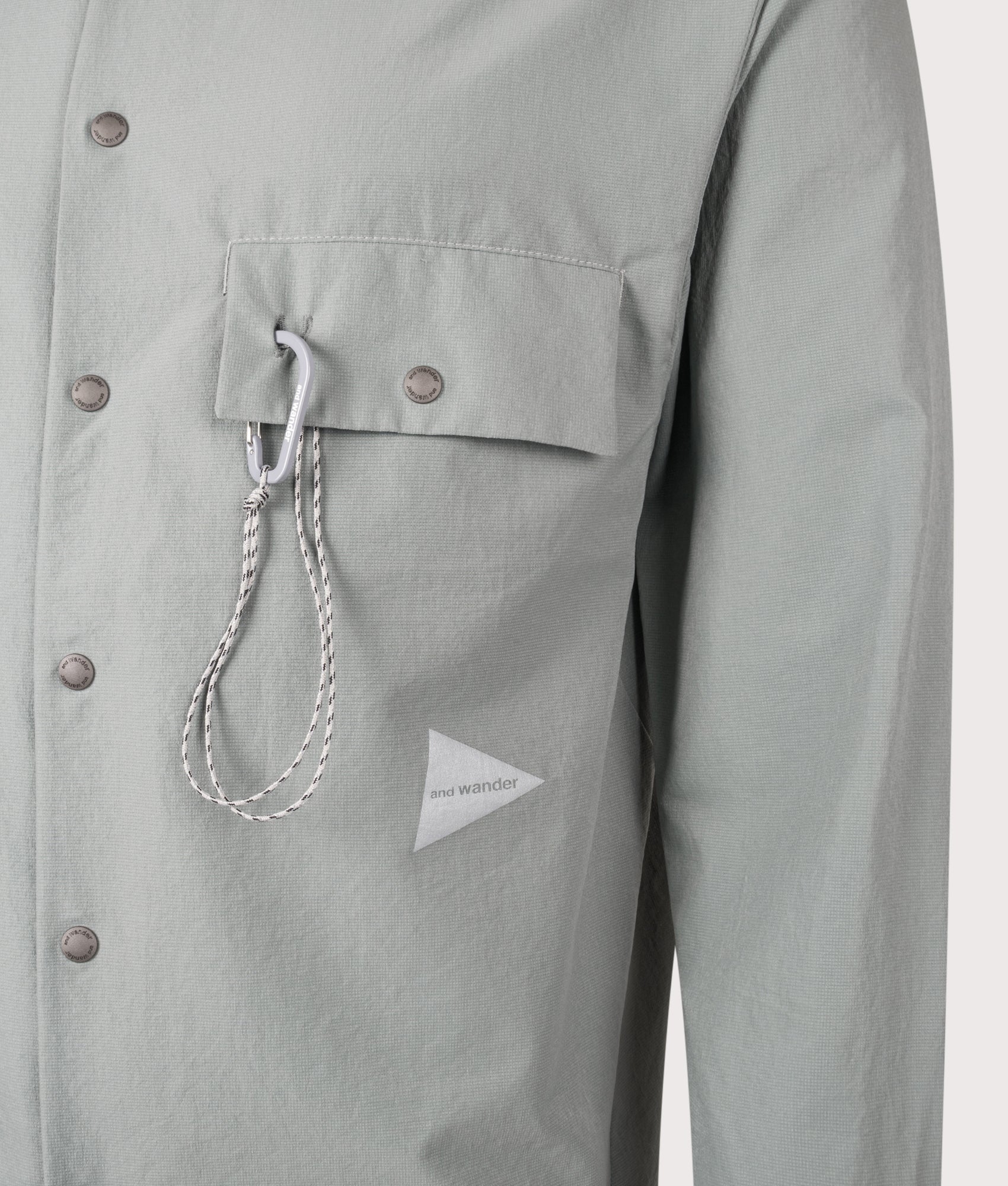 and wander Dry Breathable Hoodie in  Blue Gray a EQVVS Menswear. Detail shot.