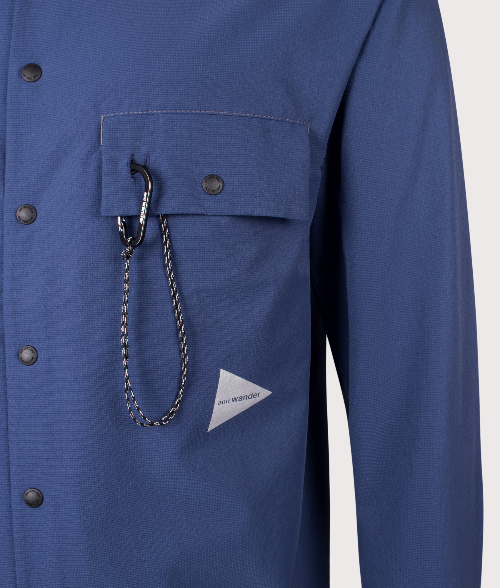 and wander Dry Breathable Shirt in Blue at EQVVS Menswear. Detail shot.