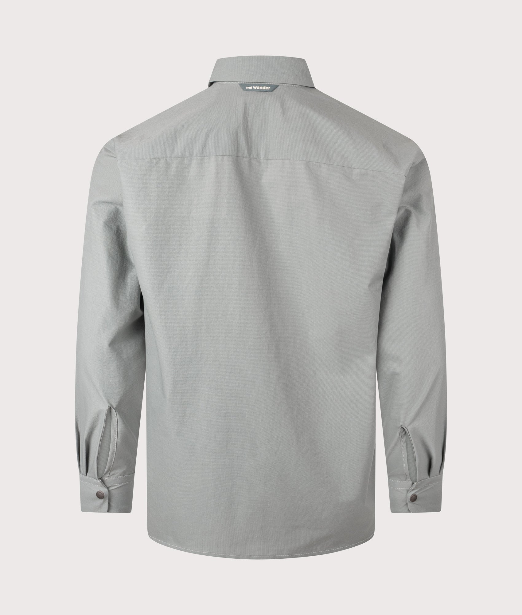 and wander Dry Breathable Shirt in Blue Gray at EQVVS Menswear. Back shot.