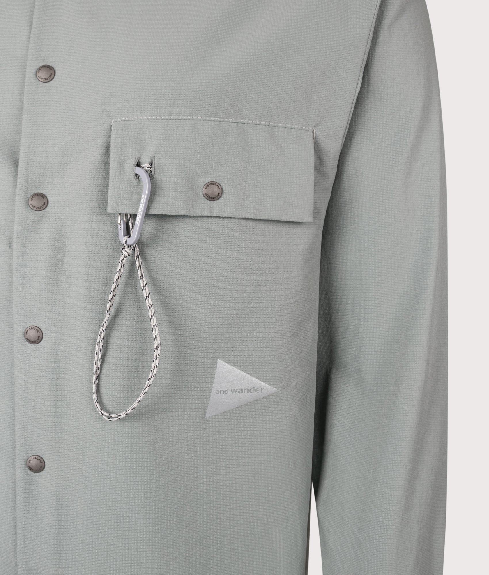 and wander Dry Breathable Shirt in Blue Gray at EQVVS Menswear. Detail shot.