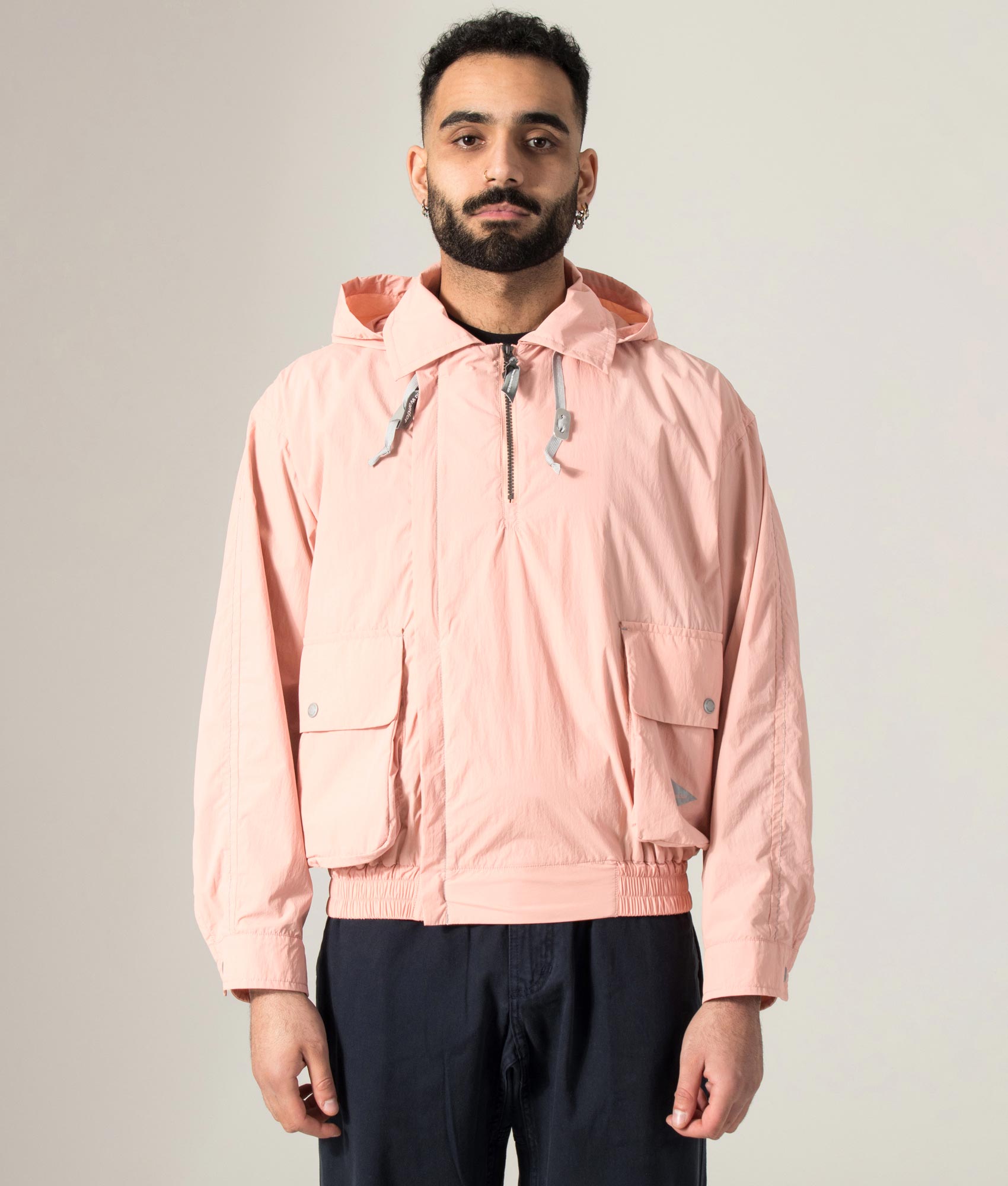 and wander Water Repellent Light Jacket 2 in Pink at EQVVS Menswear. Model shot.
