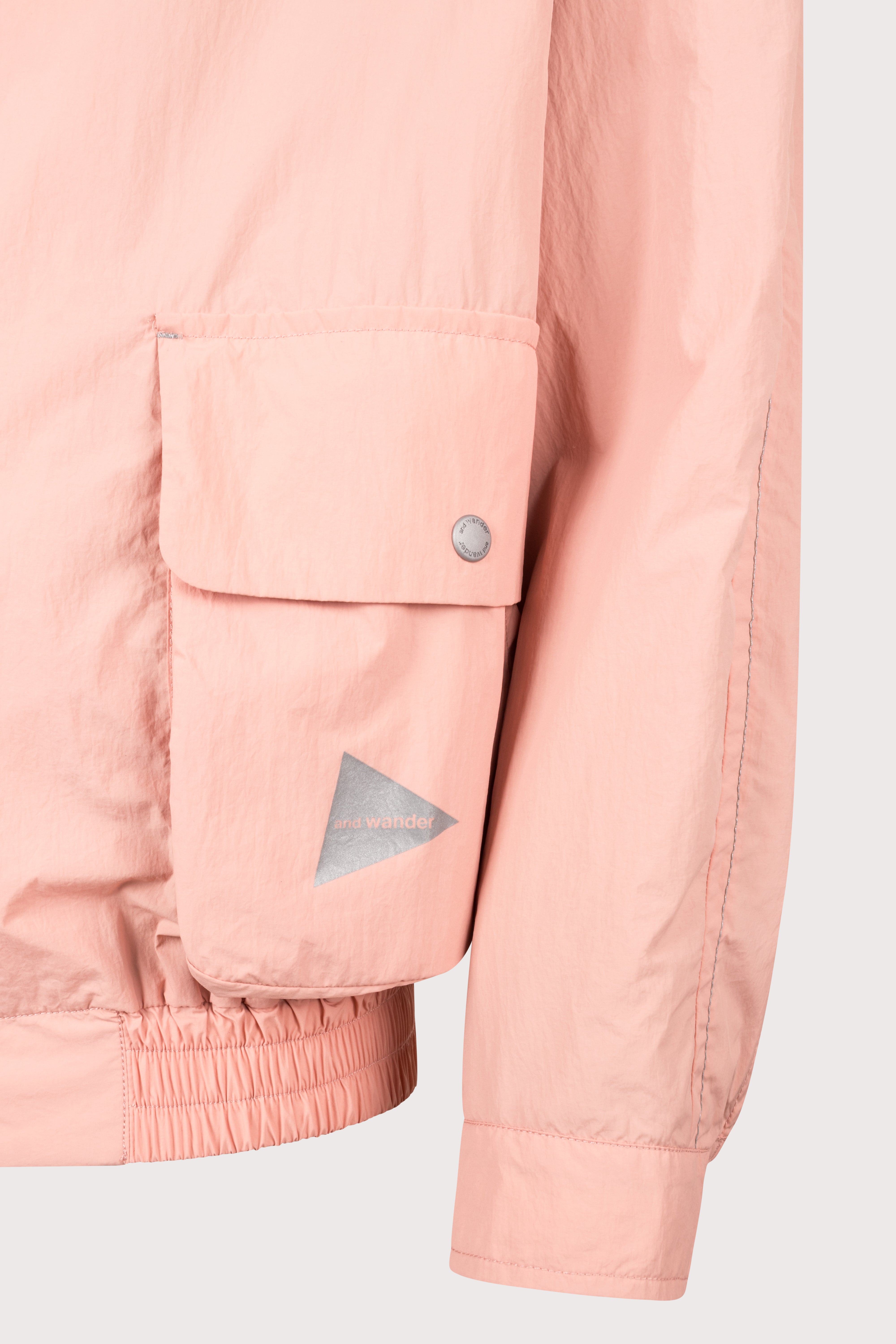 and wander Water Repellent Light Jacket 2 in Pink at EQVVS Menswear. Detail shot.