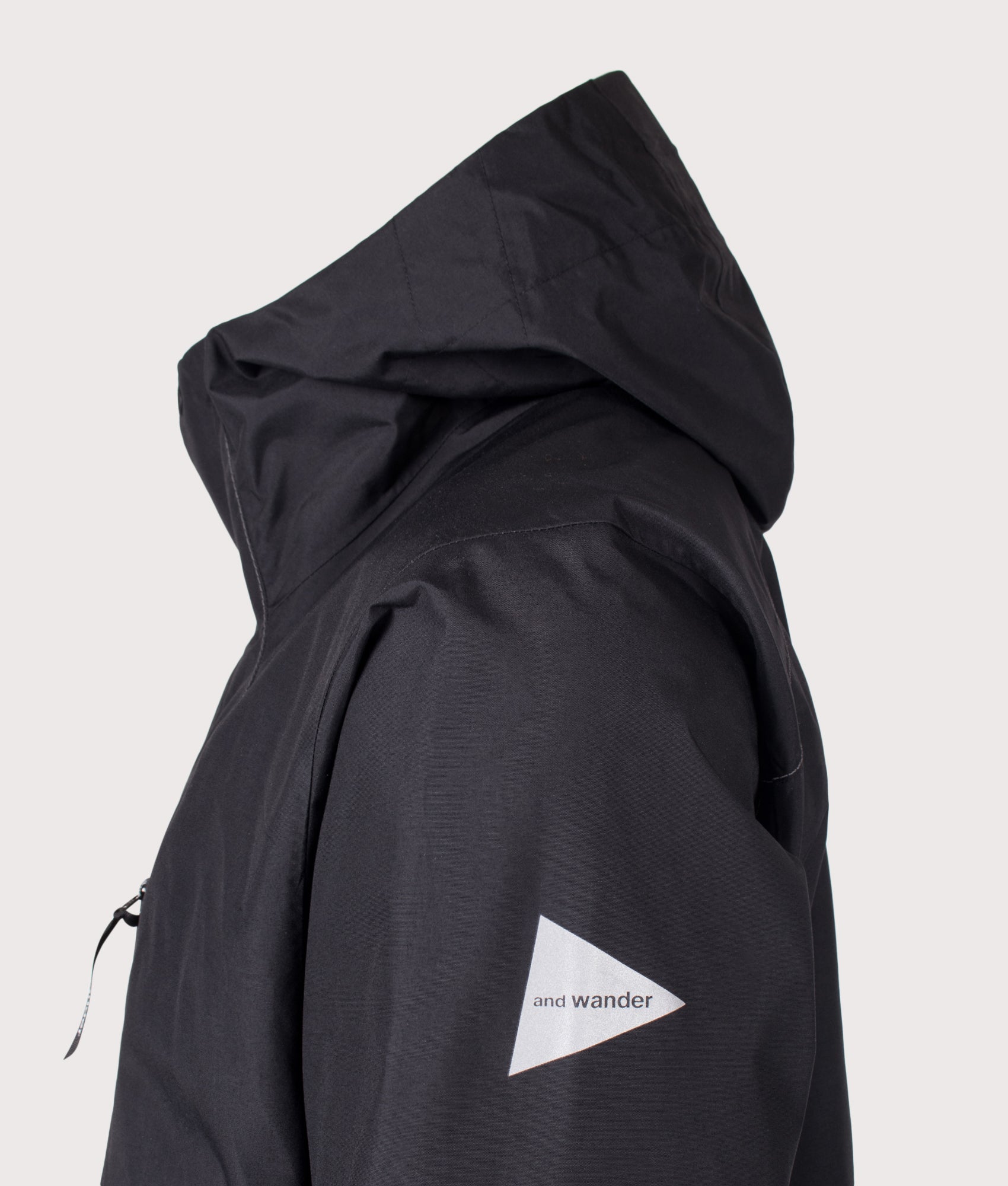 2.5L Hiker Rain Jacket in Black by and wander. Shot by EQVVS. Side detail shot.