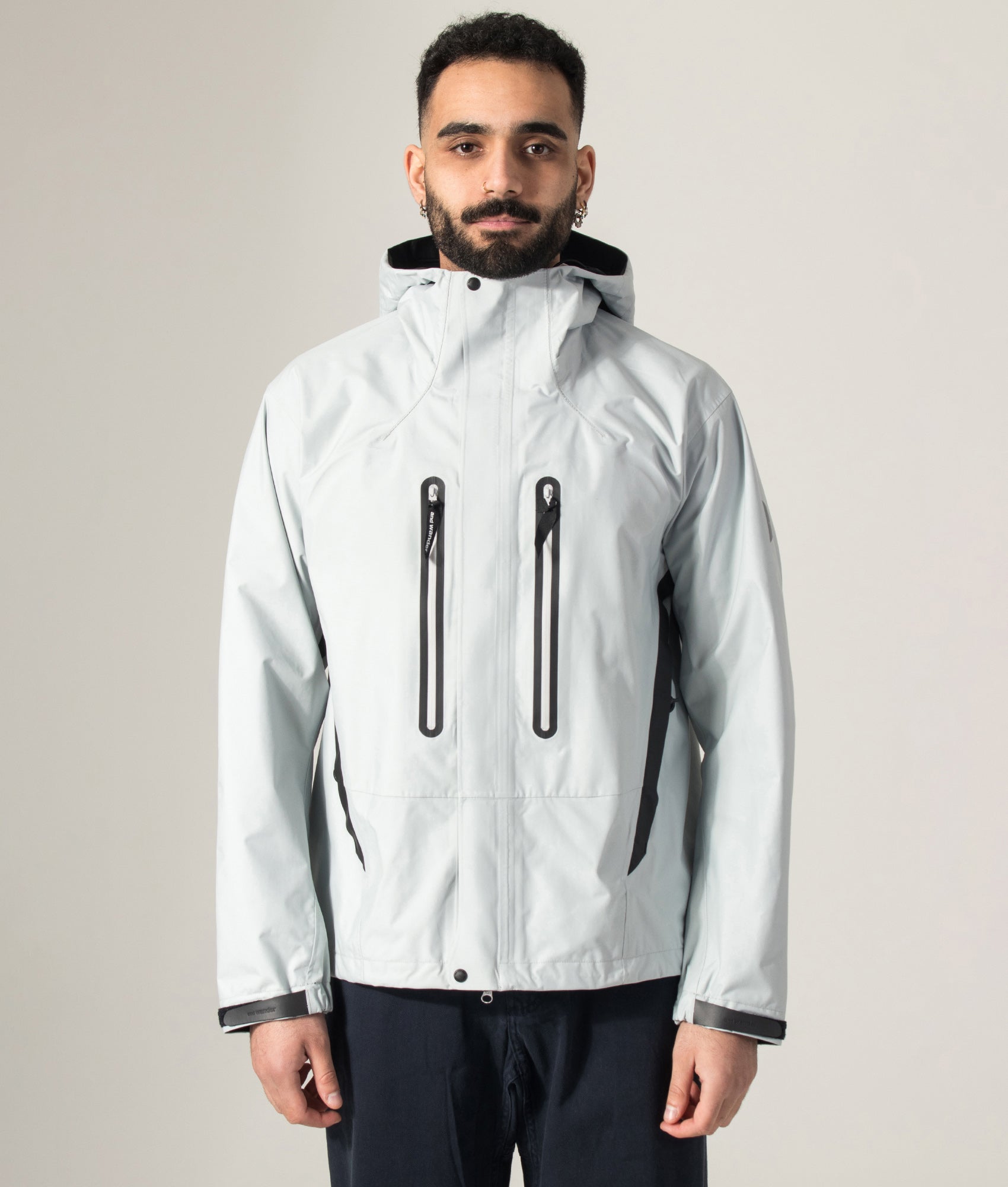 2.5L Hiker Rain Jacket in Light Grey by and wander. Shot by EQVVS. Model shot.