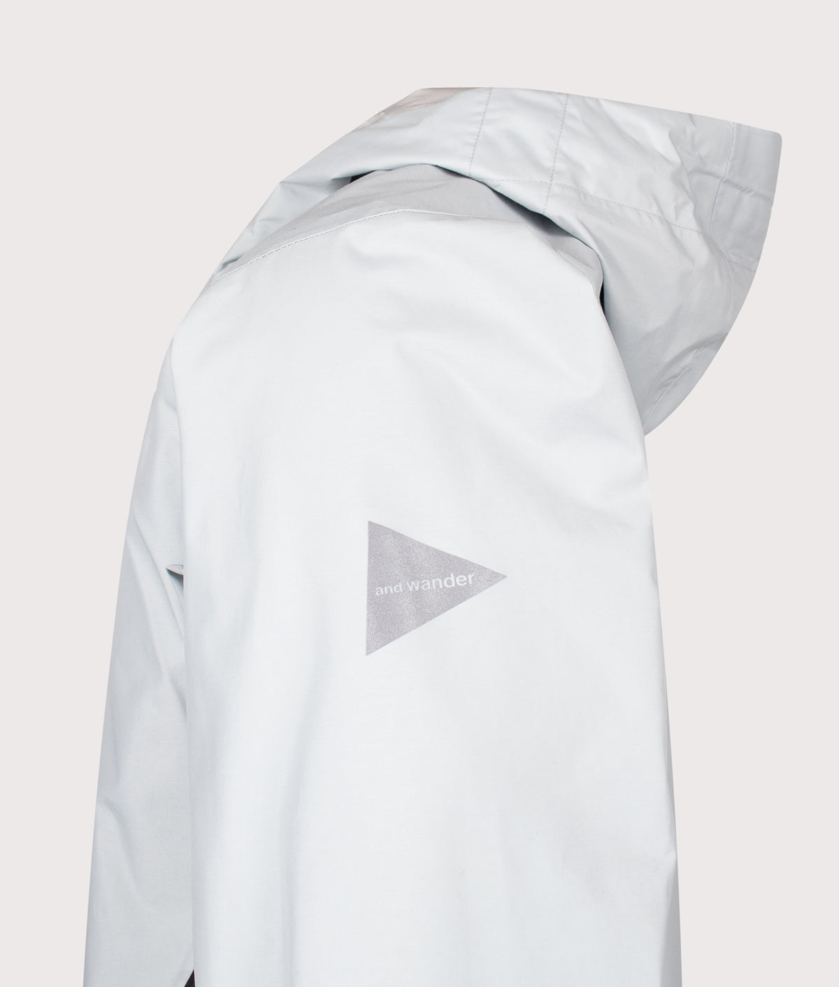 and wander 2.5L Hiker Rain Jacket in Light Gray at EQVVS Menswear. Detail shot.