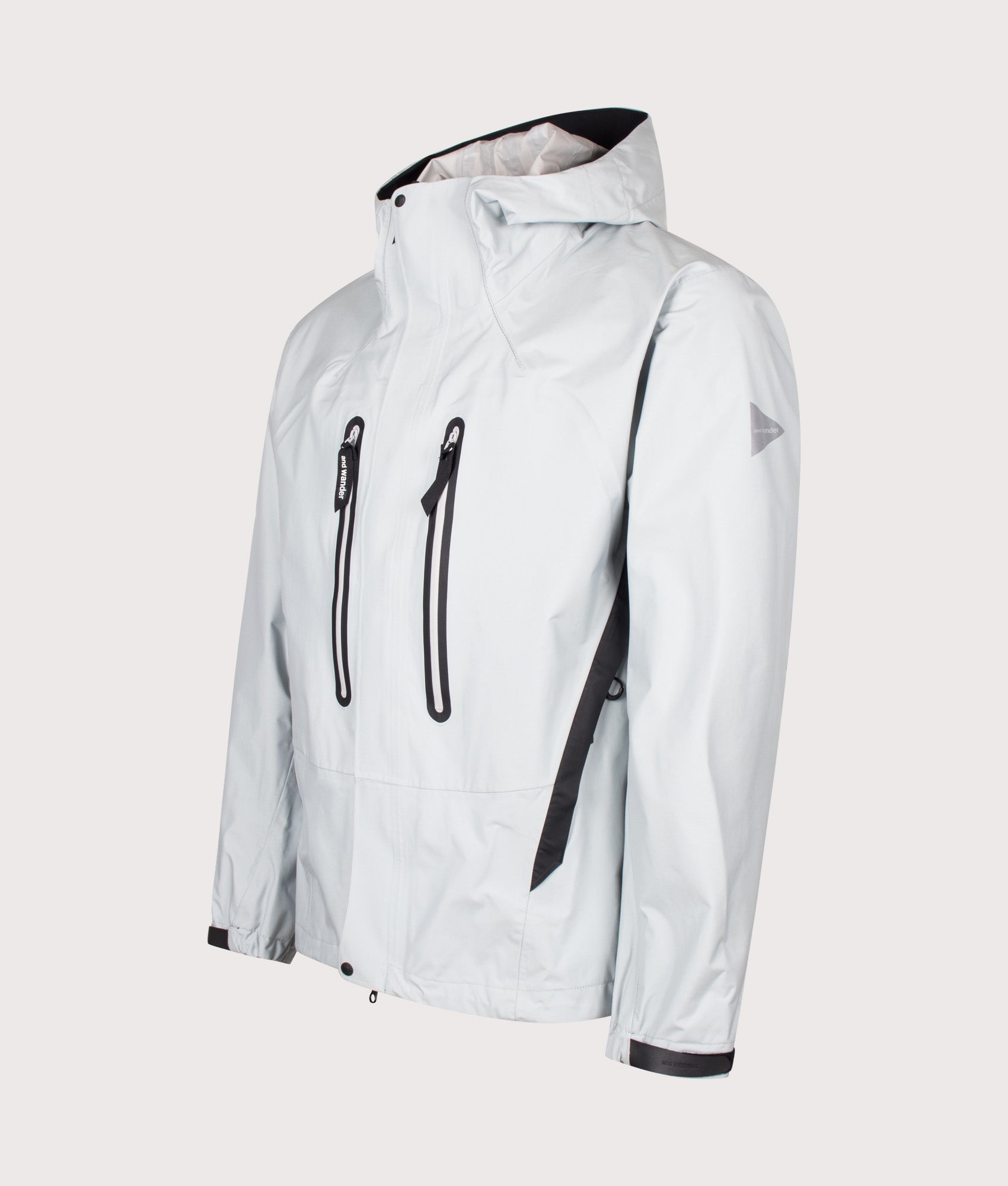 and wander 2.5L Hiker Rain Jacket in Light Gray at EQVVS Menswear. Angled front shot.