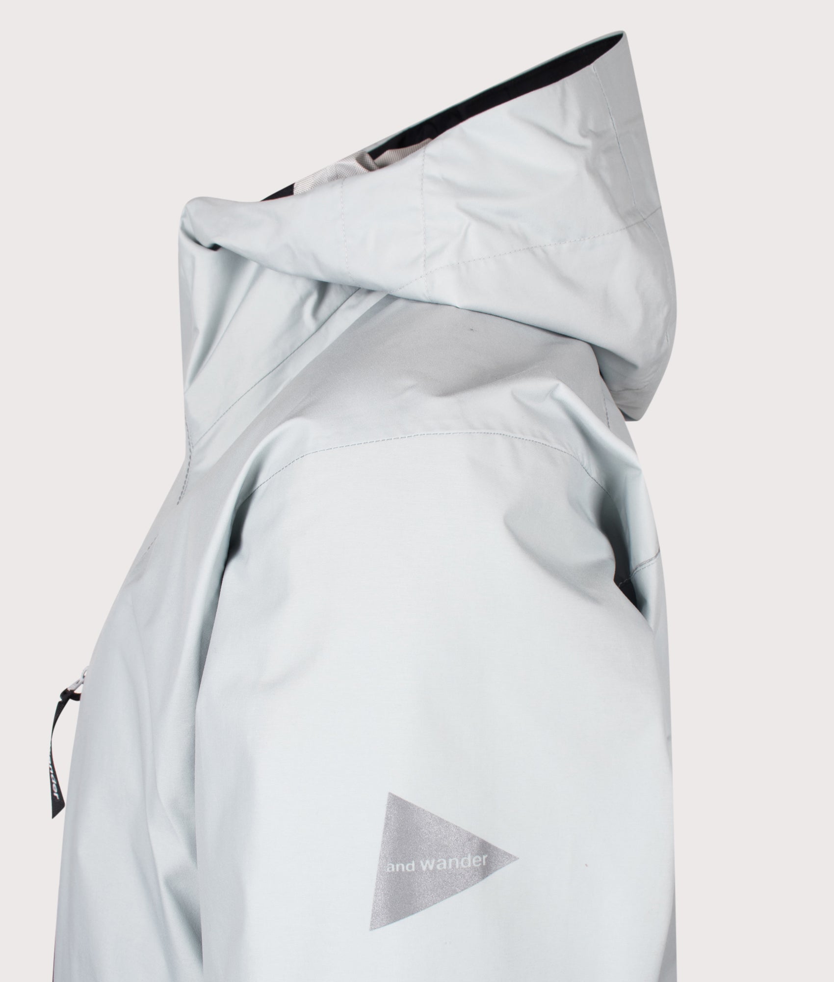 2.5L Hiker Rain Jacket in Light Grey by and wander. Shot by EQVVS. Detail shot.