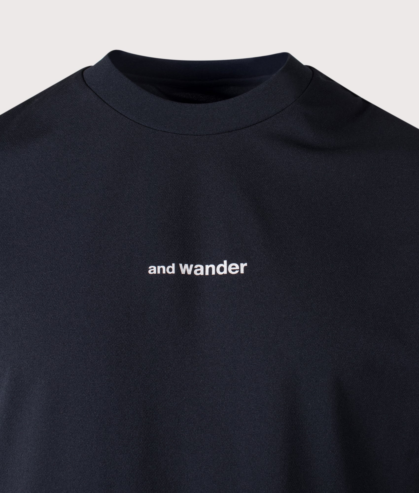 and wander Dry Mesh T-Shirt in Black at EQVVS Menswear. Detail shot.