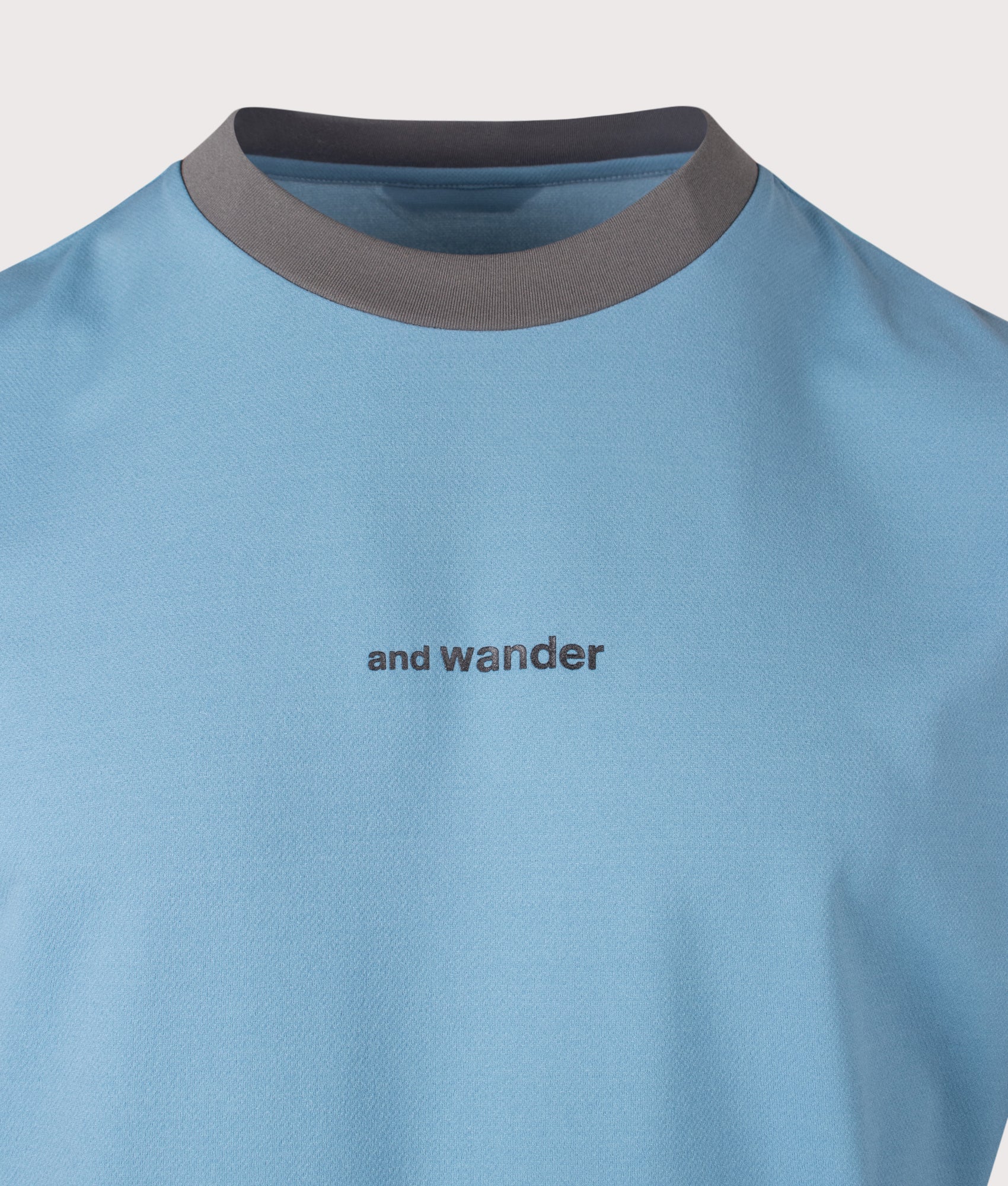 and wander Dry Mesh T-Shirt in Light Blue at EQVVS Menswear. Detail shot.