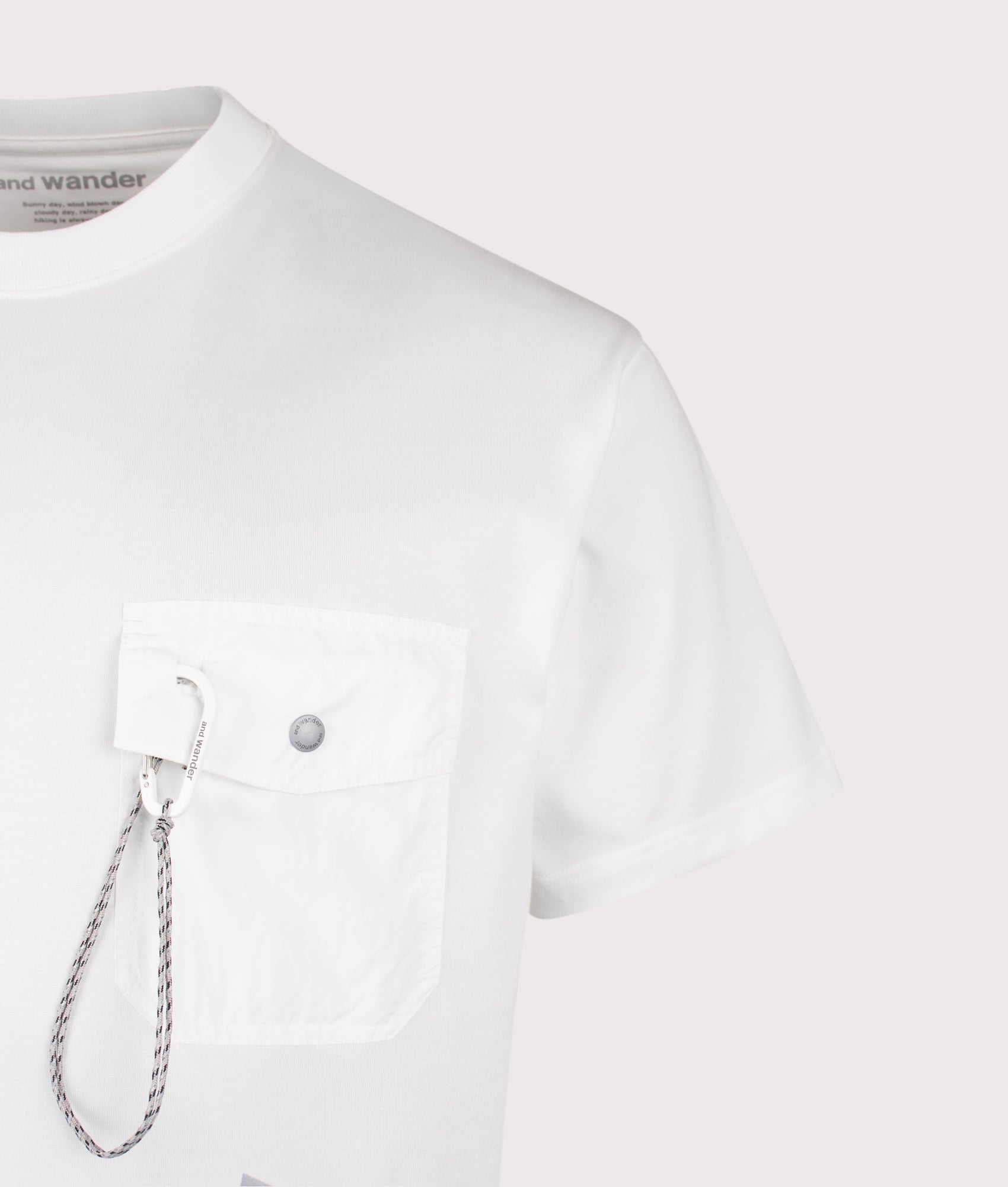 and wander Pocket T-Shirt in Off White at EQVVS Menswear. Detail shot.