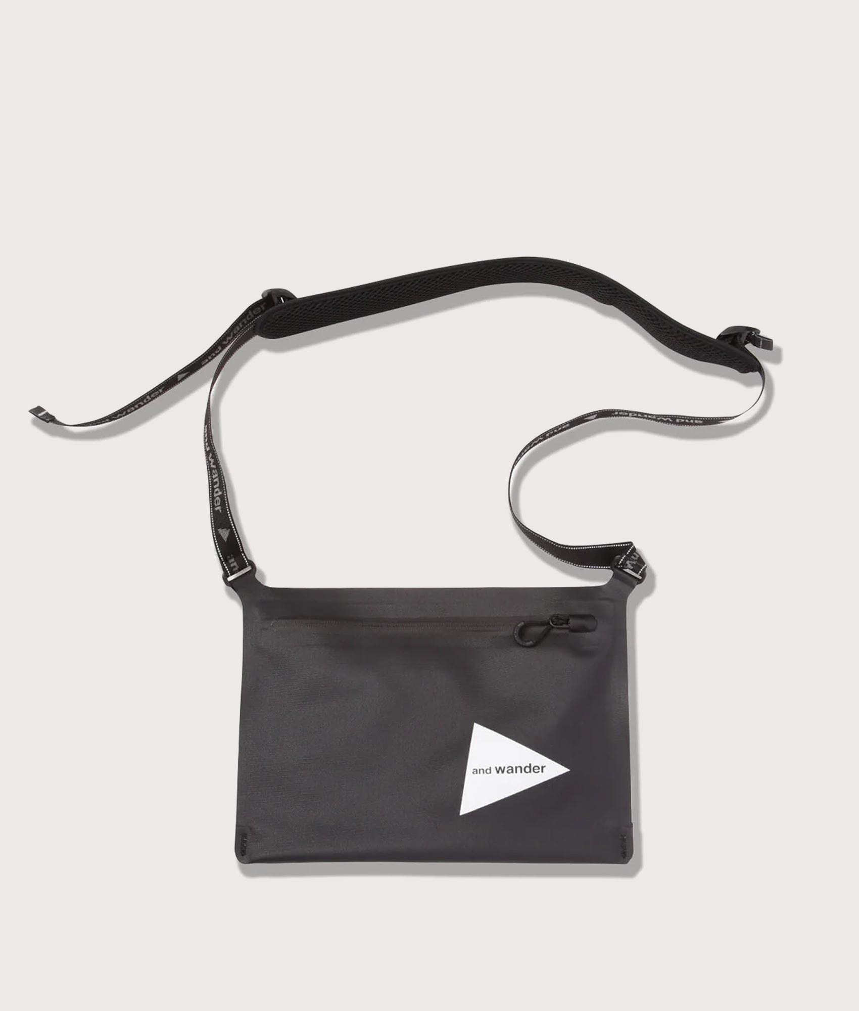 and wander Waterproof Satchel Bag in Black at EQVVS Menswear. Front shot.