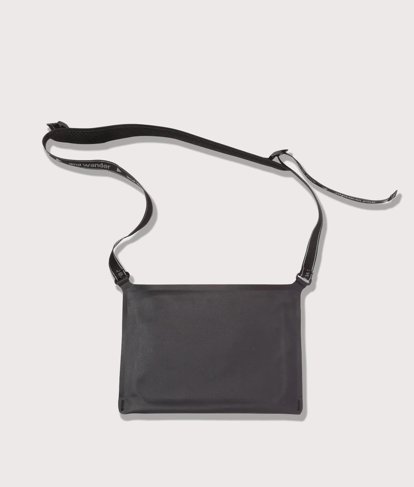 and wander Waterproof Satchel Bag in Black at EQVVS Menswear. Back shot.