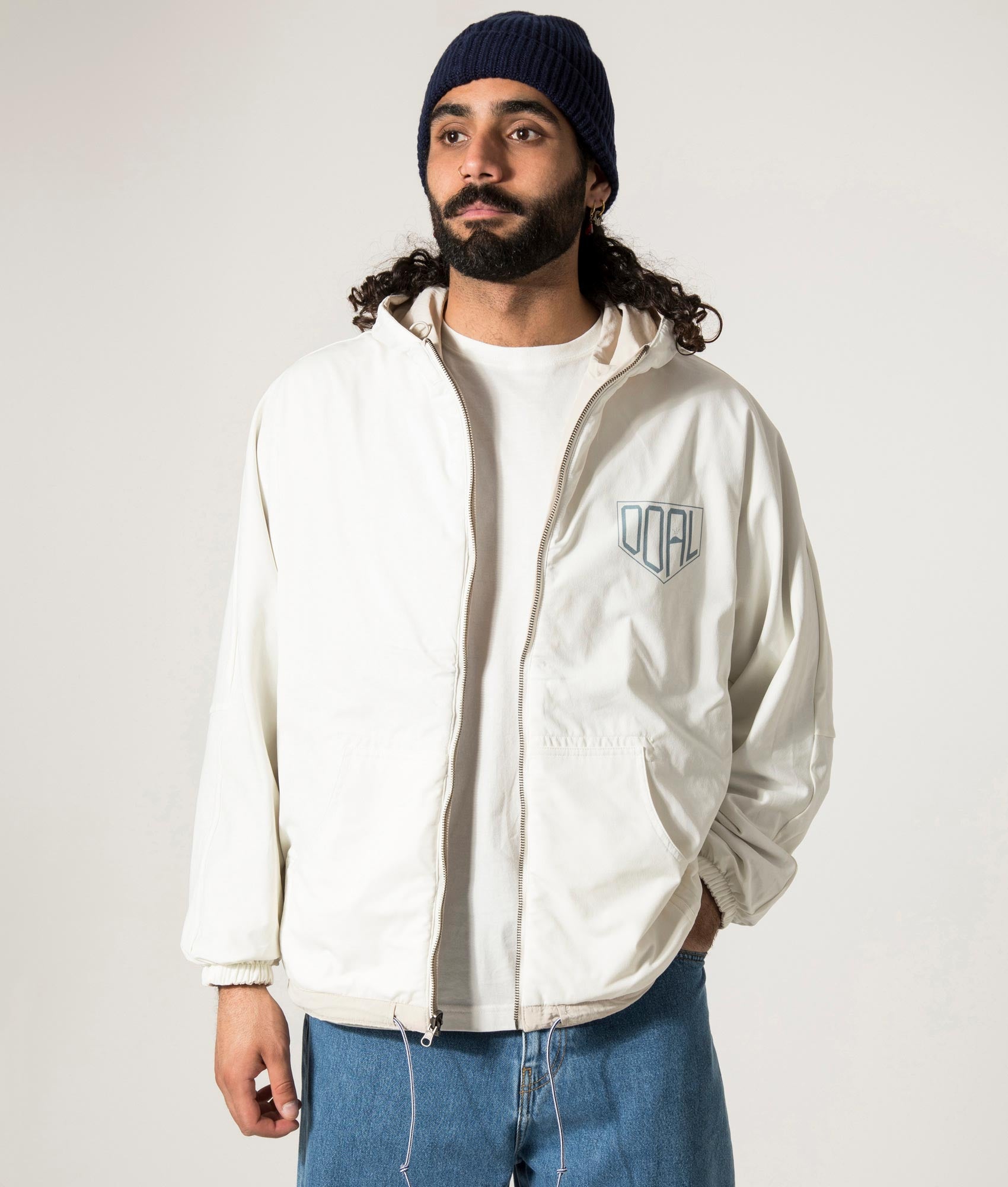 nanamica Reversible Hooded Jacket in Sand Beige. EQVVS Reversed Model Front Shot.