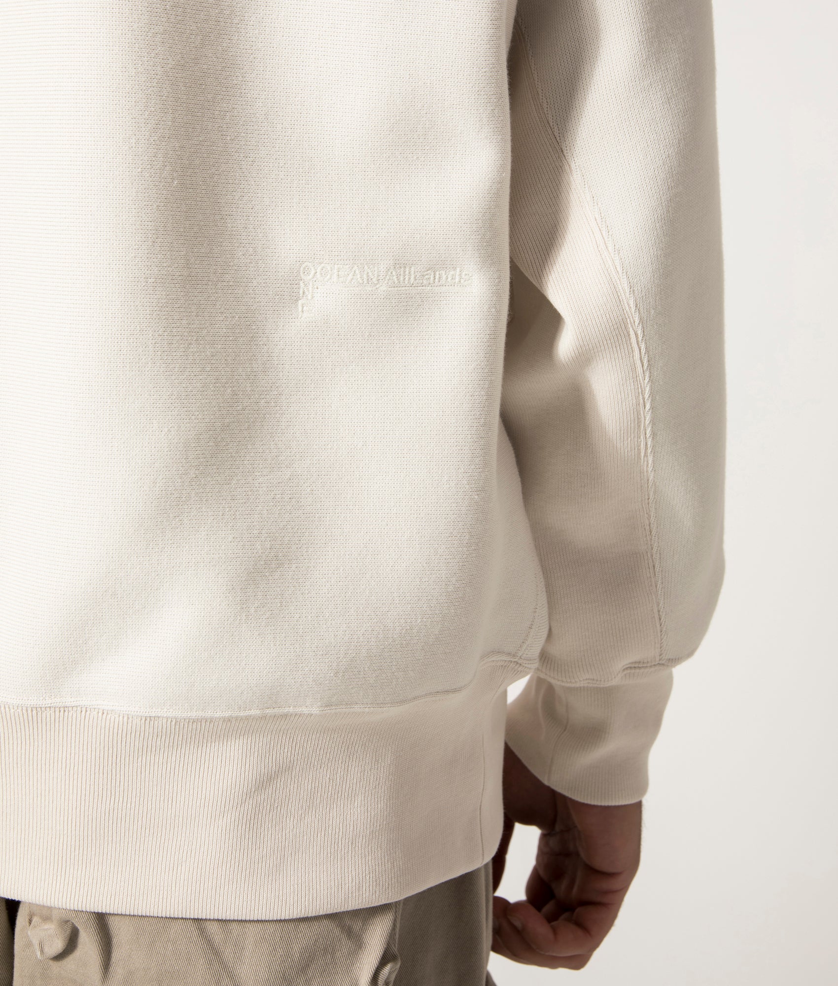nanamica Hooded Pullover Sweat in Ivory at EQVVS. Model Back Detail Shot.