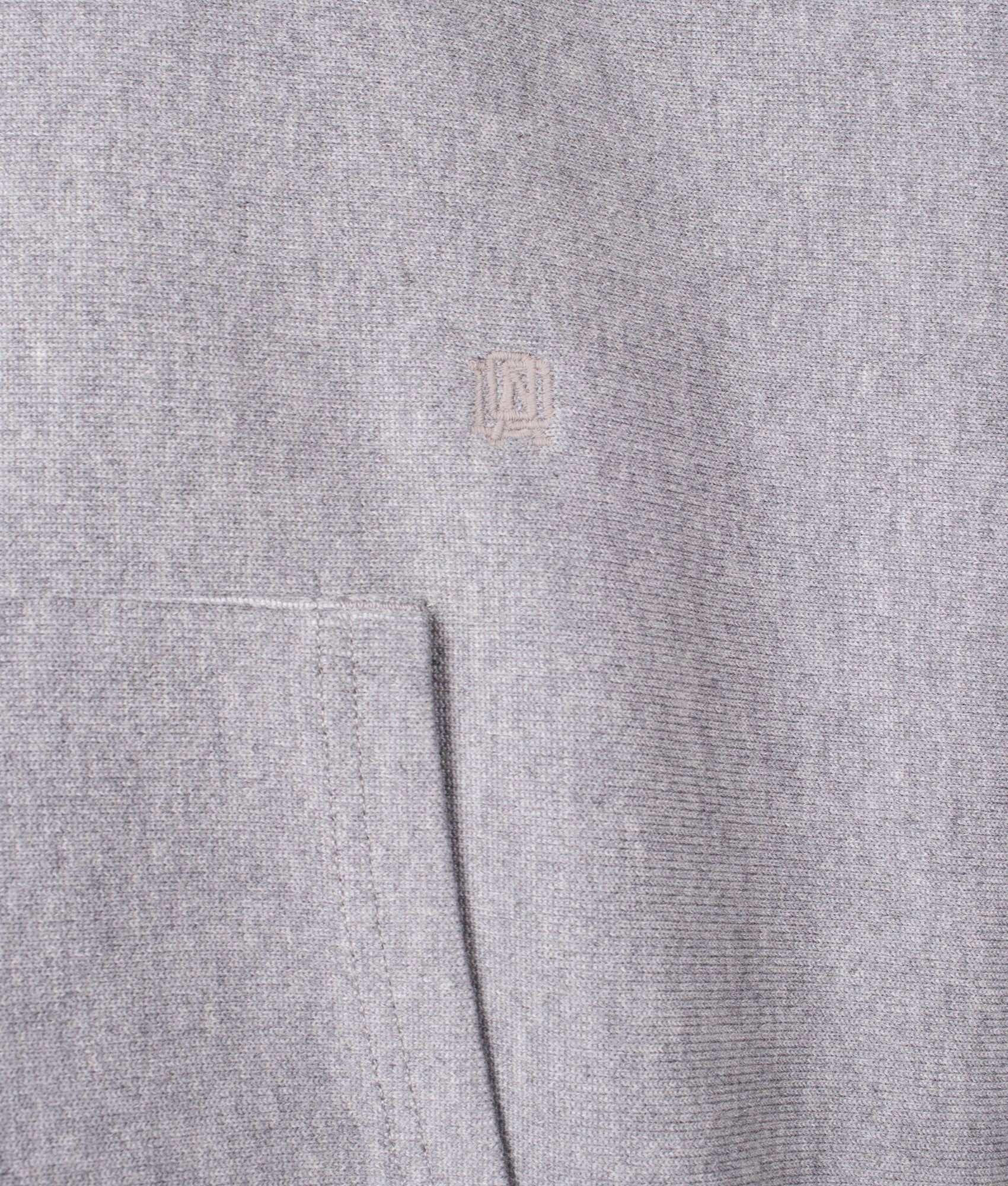 Nanamica Pullover sweat hoodie in Heather Grey at EQVVS Menswear. Detail shot.