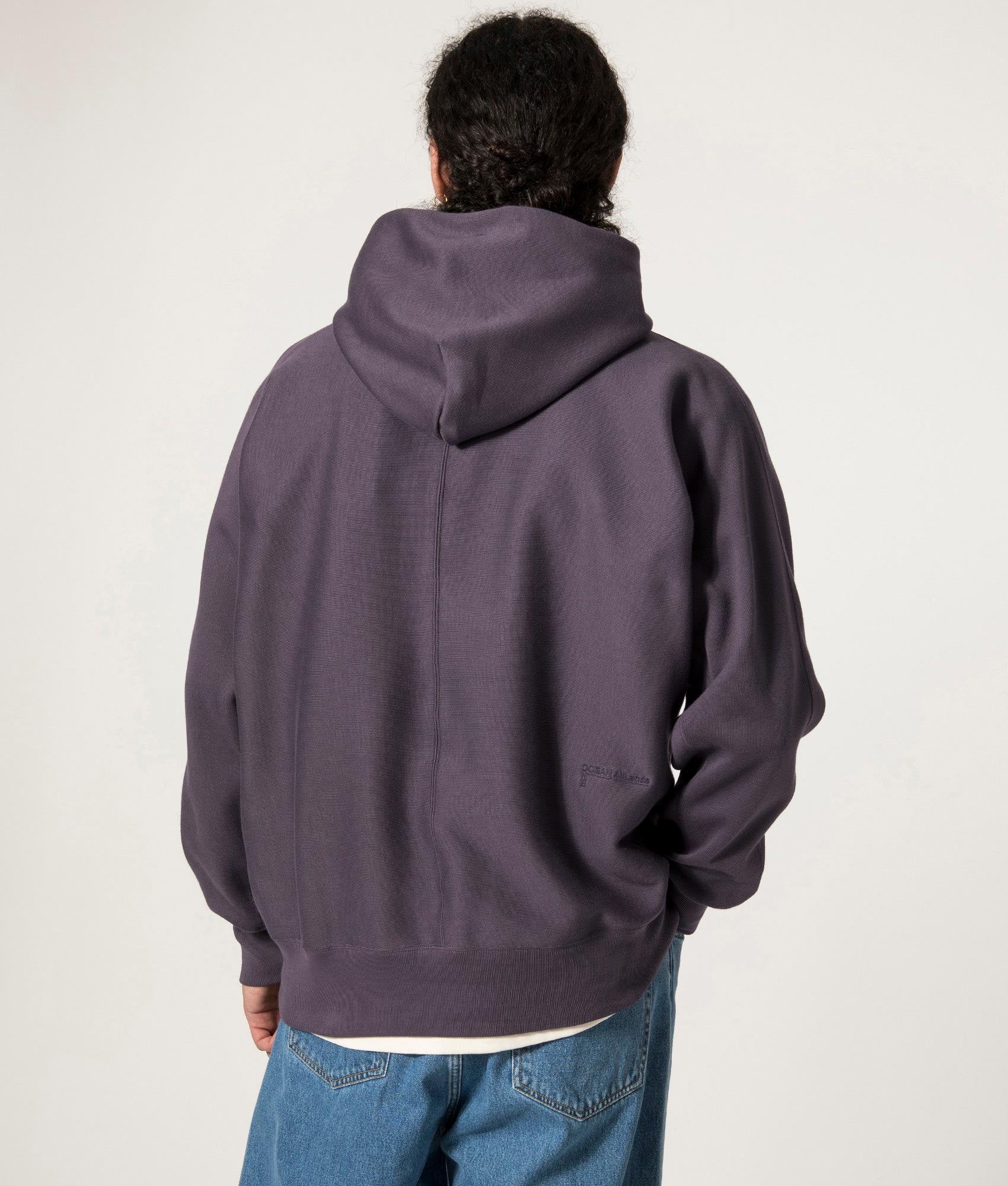 nanamica Hooded Pullover Sweat in Vintage Navy at EQVVS. Model Back Shot.