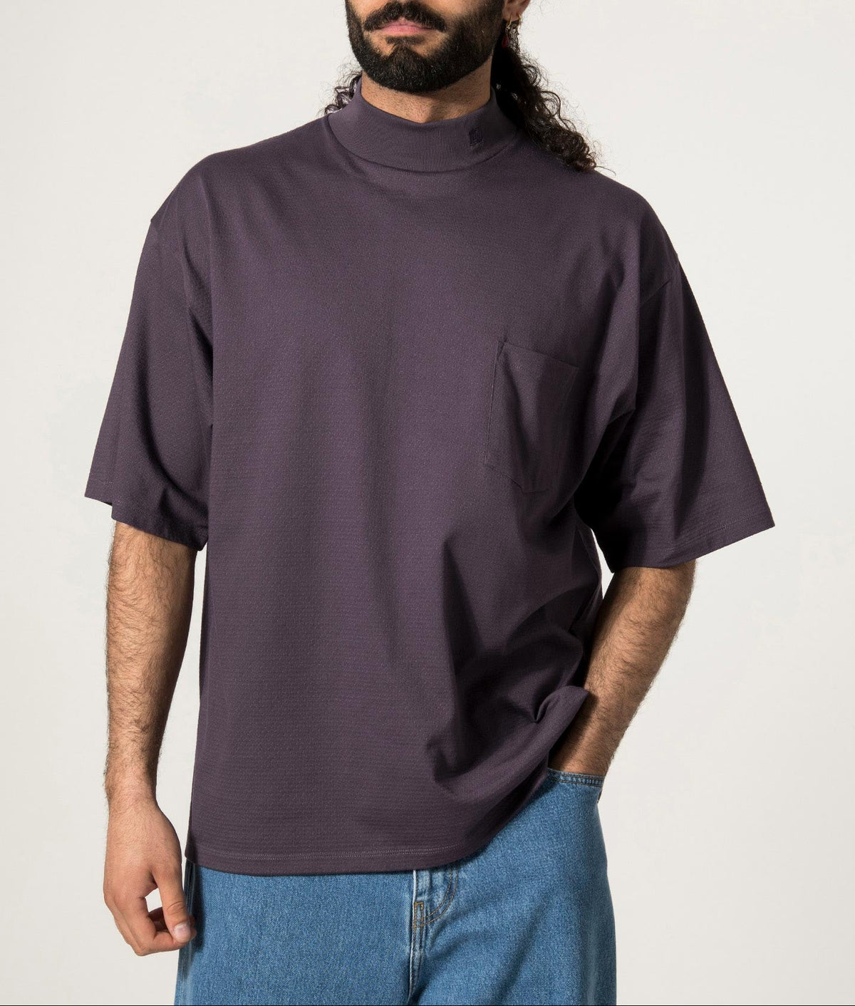 nanamica Mock Neck T-Shirt in Vintage Navy at EQVVS. Model Front Shot.