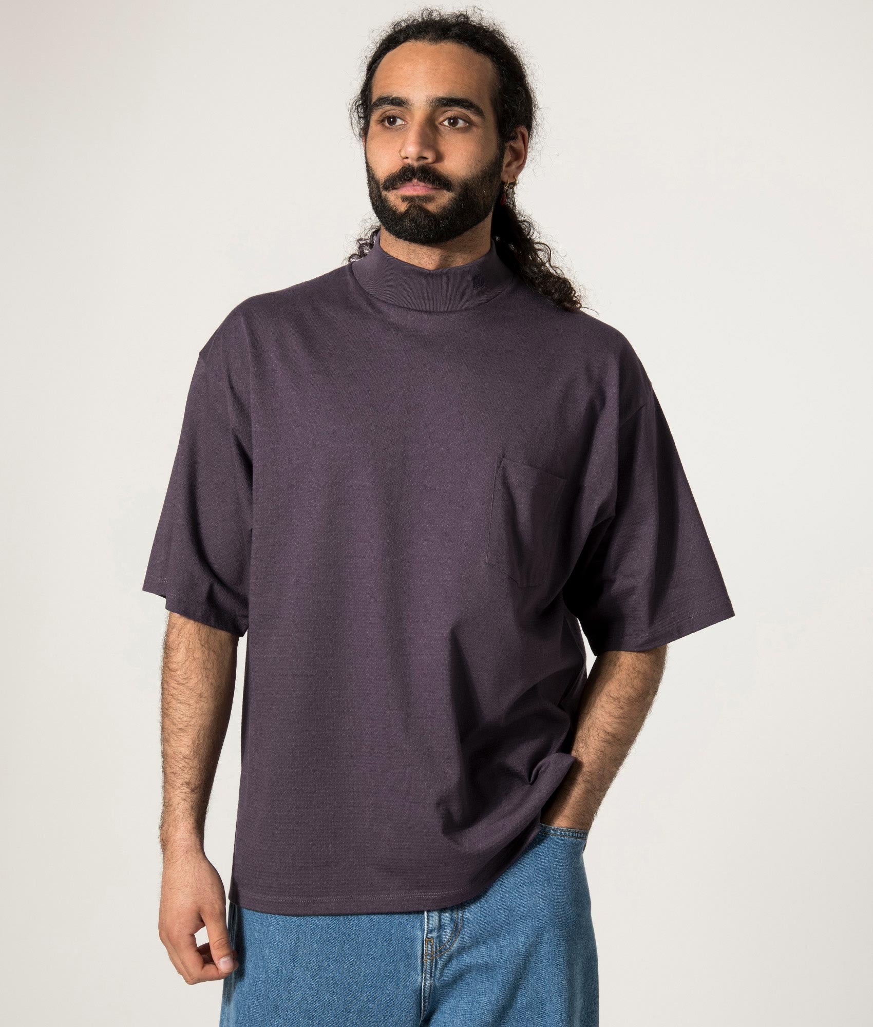 nanamica Mock Neck T-Shirt in Vintage Navy at EQVVS. Model Front Shot.