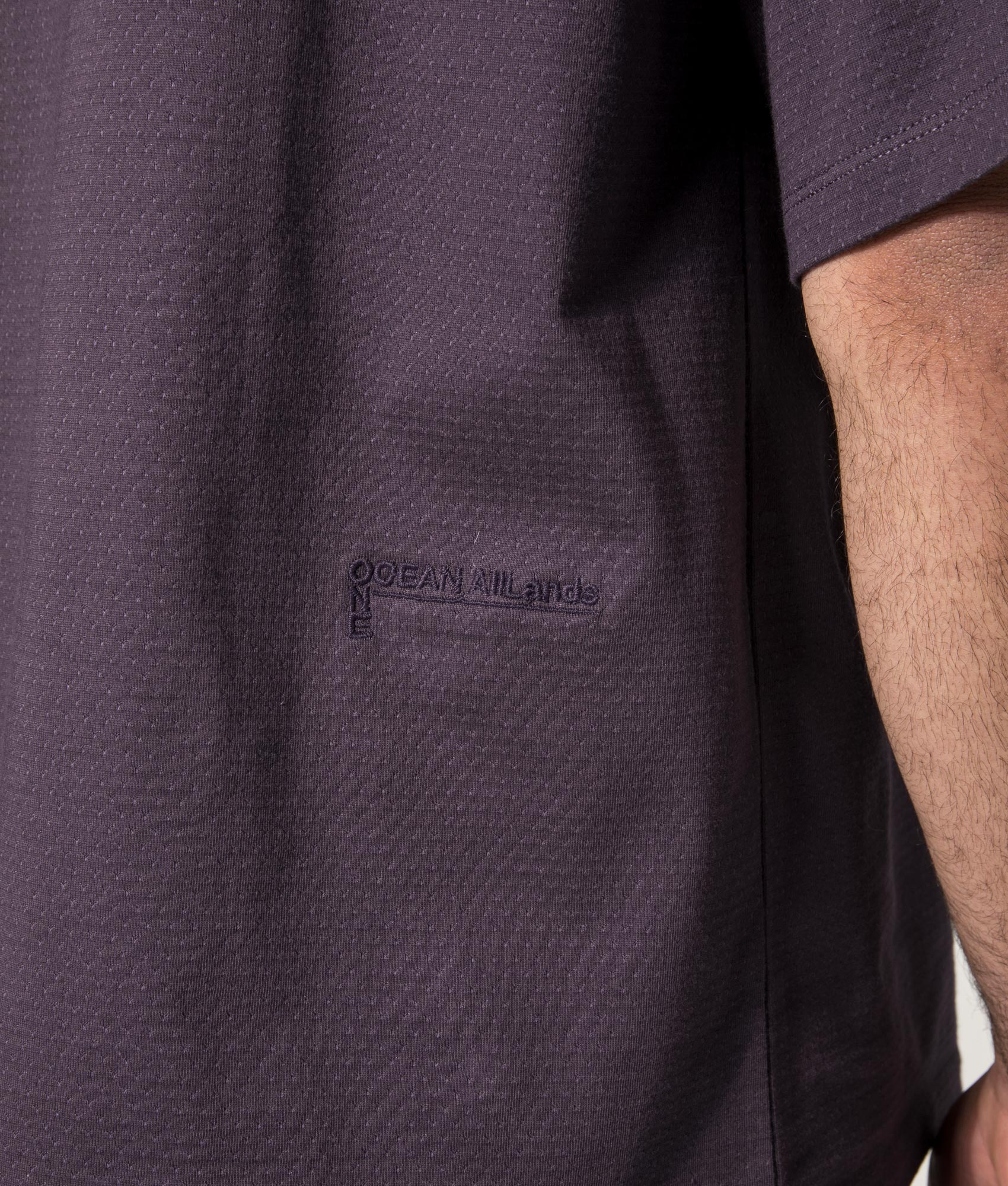 nanamica Mock Neck T-Shirt in Vintage Navy at EQVVS. Model Back detail Shot.