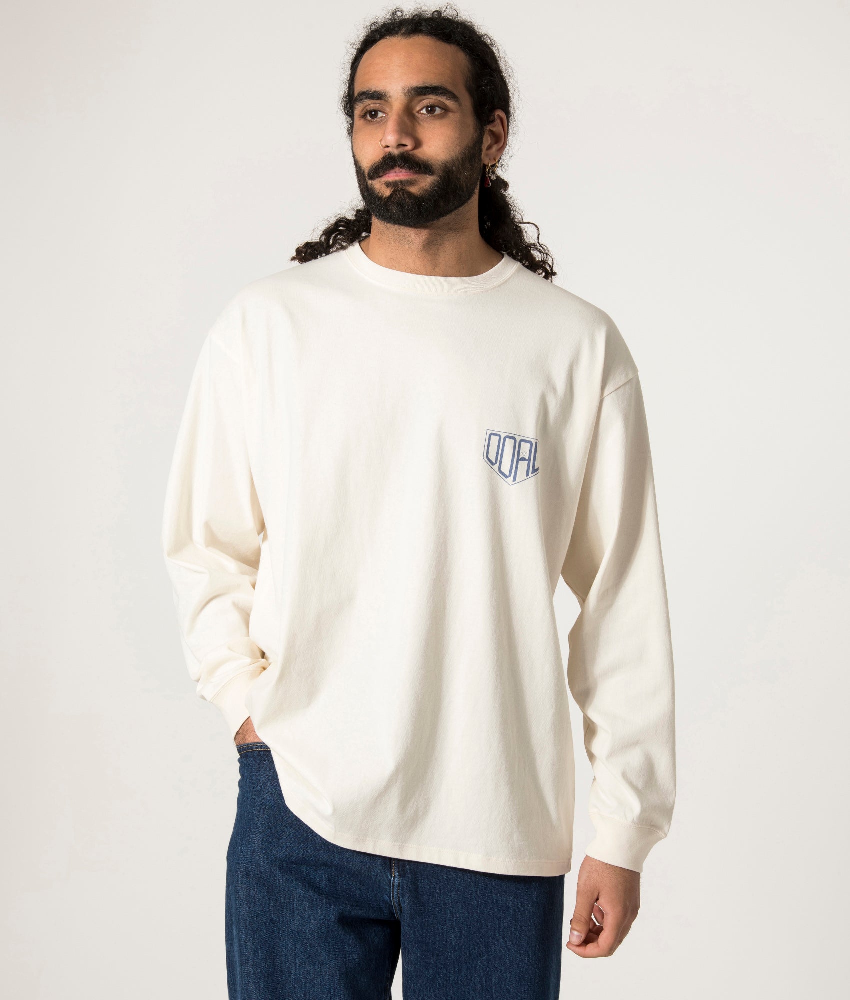 nanamica OOAL Long Sleeve Graphic T-Shirt in Ivory at EQVVS. Model Front Shot.