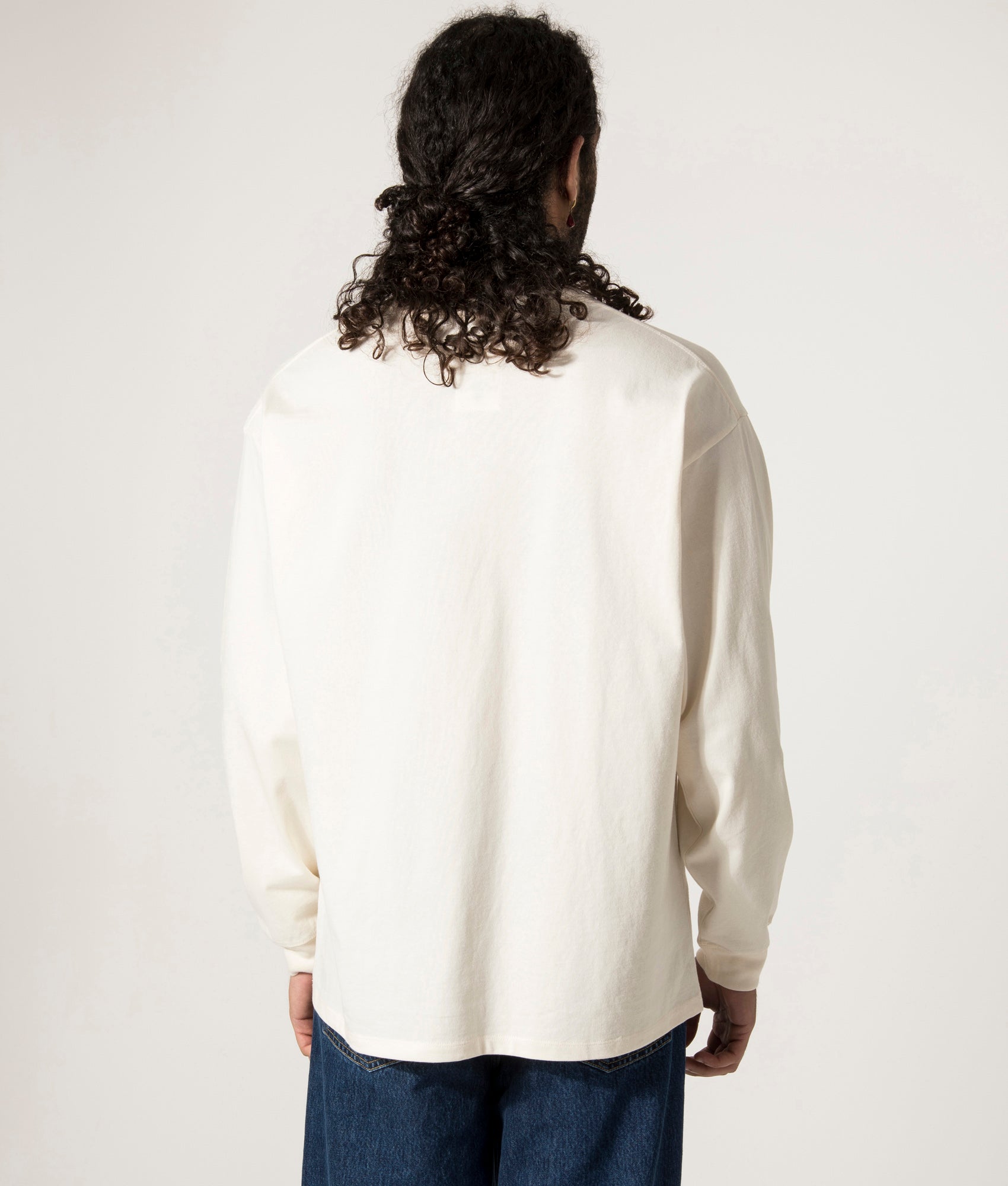 nanamica OOAL Long Sleeve Graphic T-Shirt in Ivory at EQVVS. Model Back Shot.