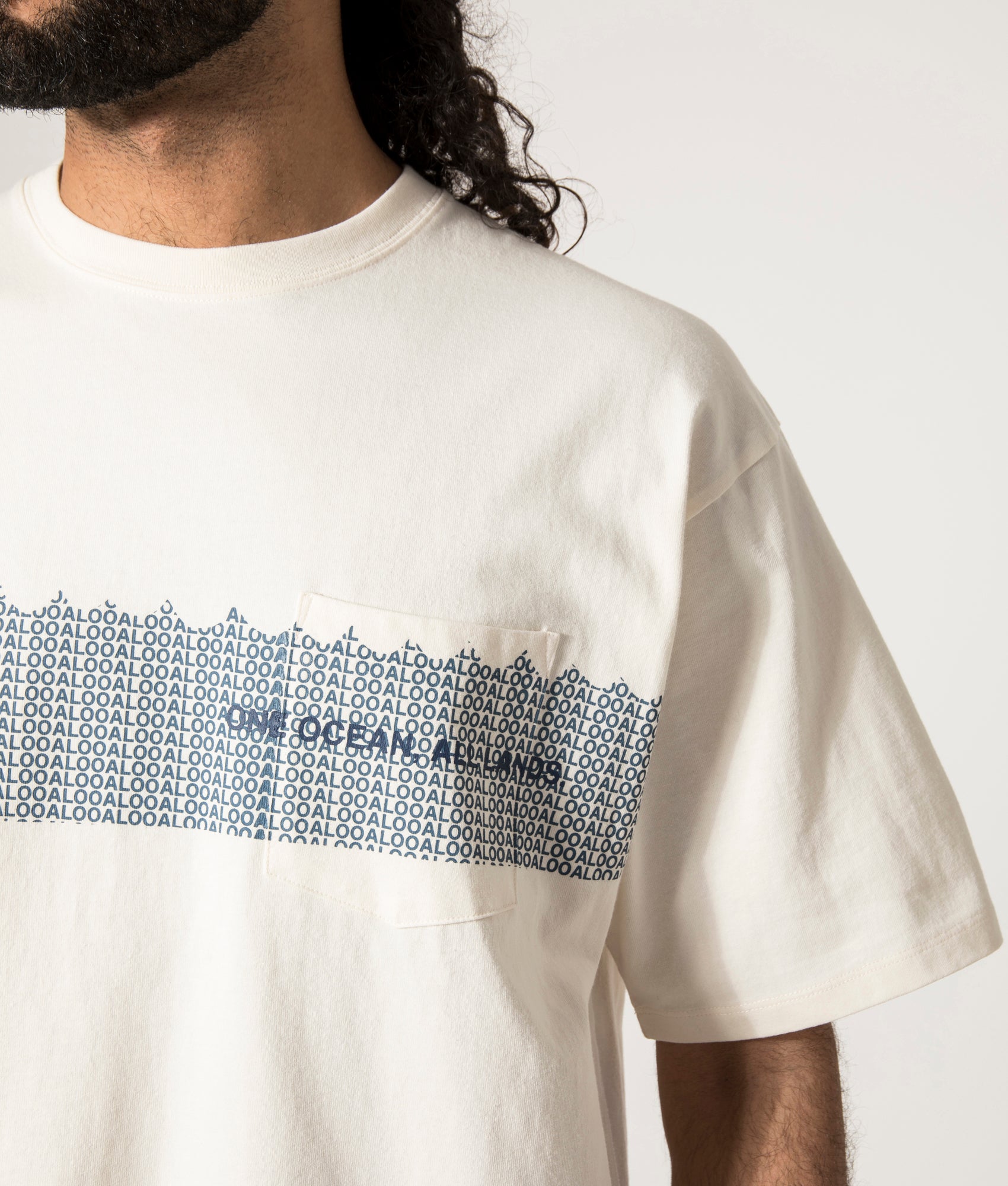 nanamica OOAL Graphic T-Shirt in Ivory at EQVVS. Model Front Detail Shot.