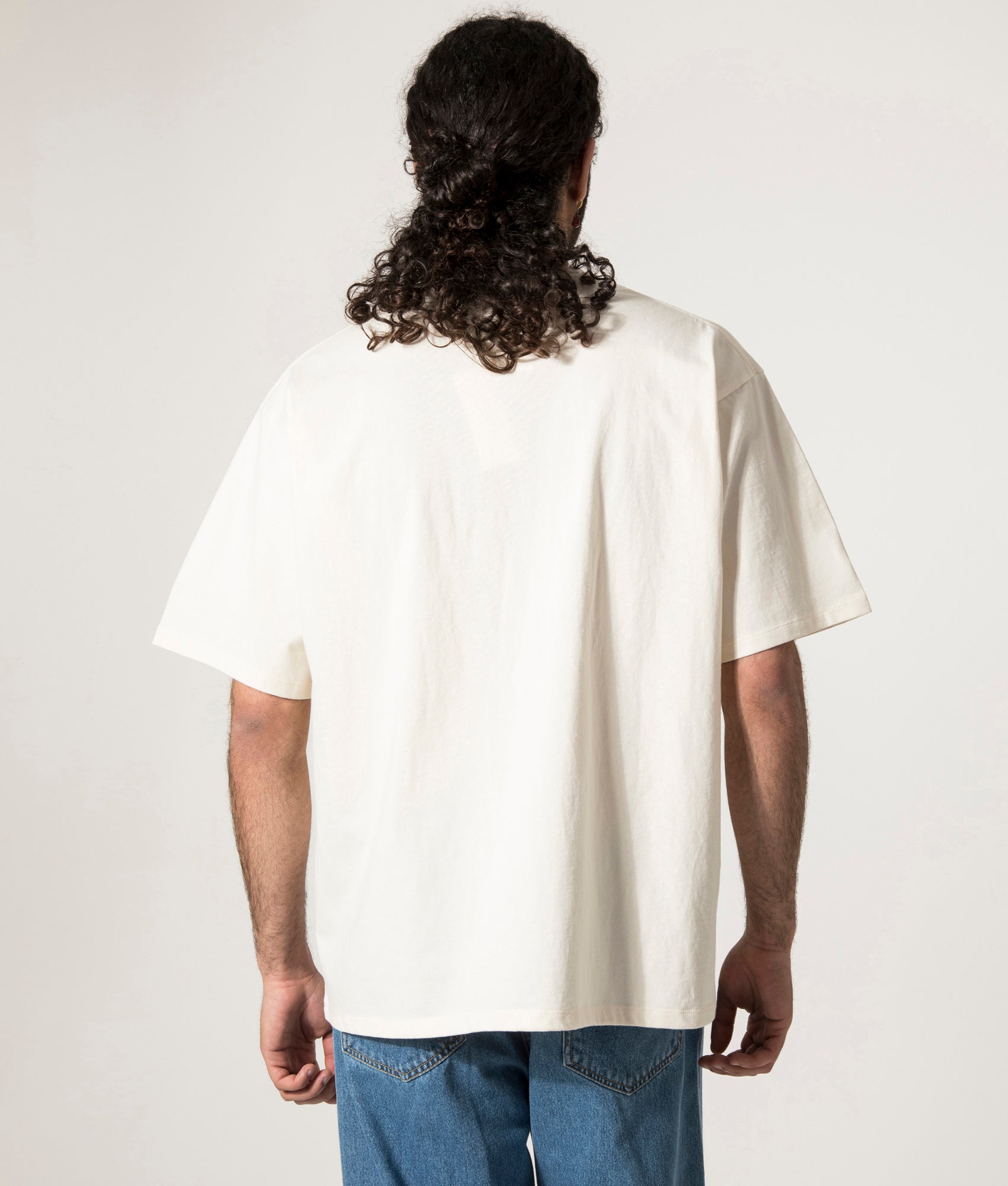 nanamica OOAL Graphic T-Shirt in Ivory at EQVVS. Model Back Shot.