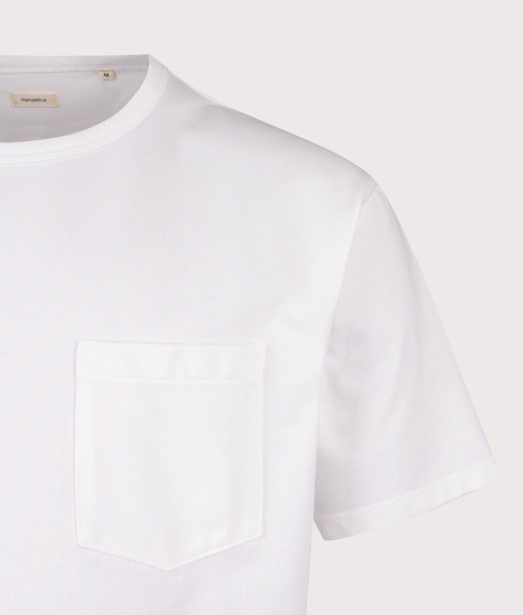 nanamica Relaxed Fit COOLMAX Jersey Pocket T-Shirt in White at EQVVS Menswear. Detail shot.