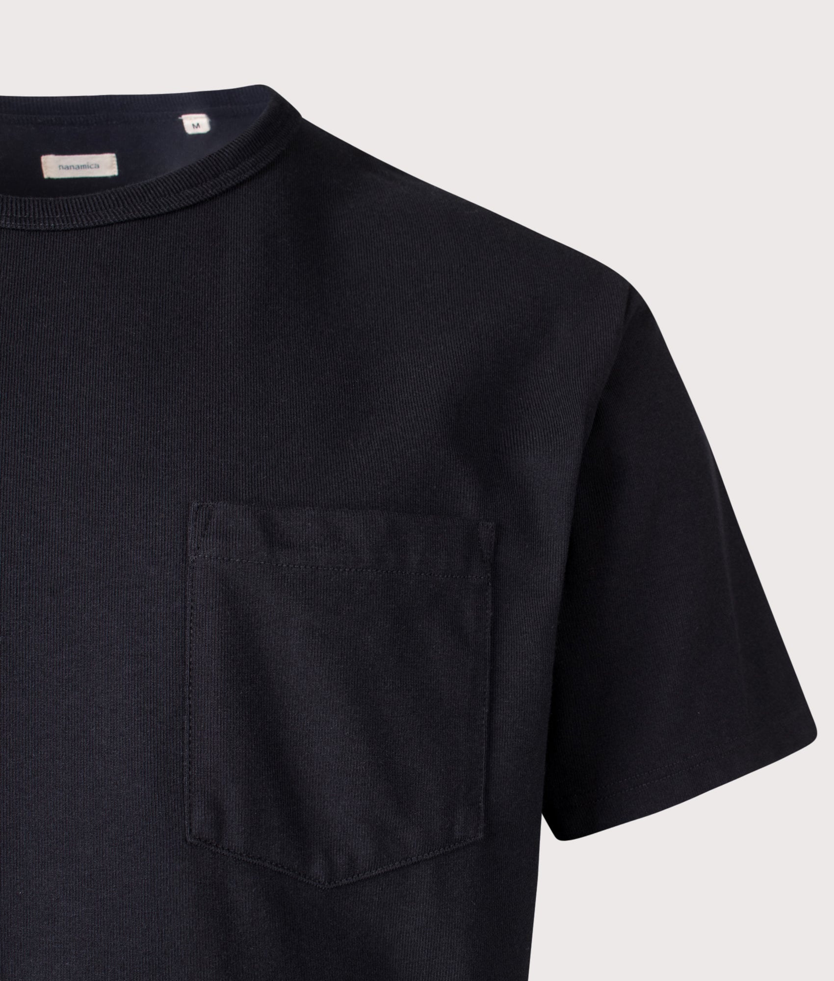 nanamica Relaxed Fit COOLMAX® Jersey Pocket T-Shirt in Black at EQVVS Menswear. Detail shot.