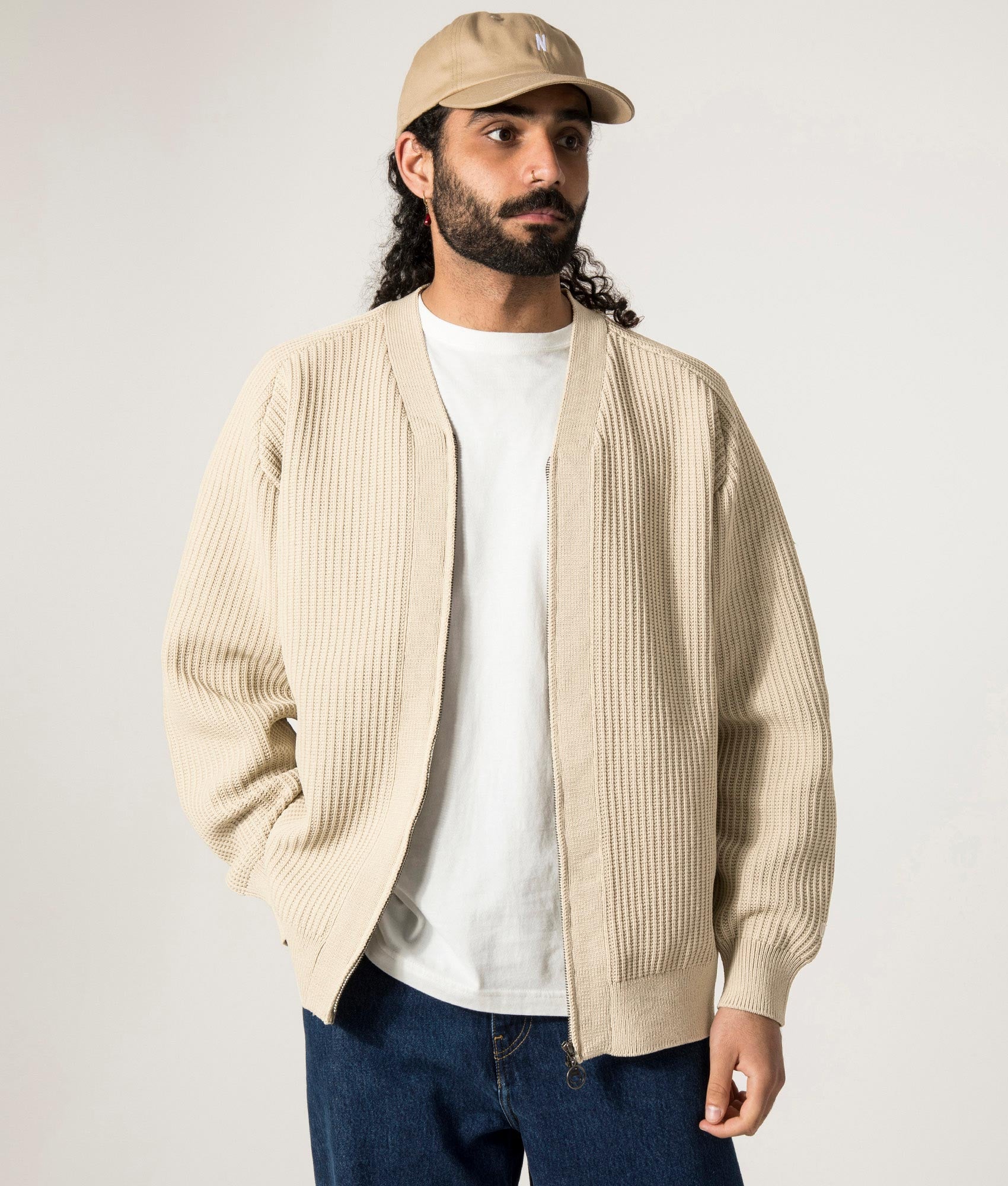 nanamica 5G Zip Through Cardigan in Ivory at EQVVS. Model Front Shot.