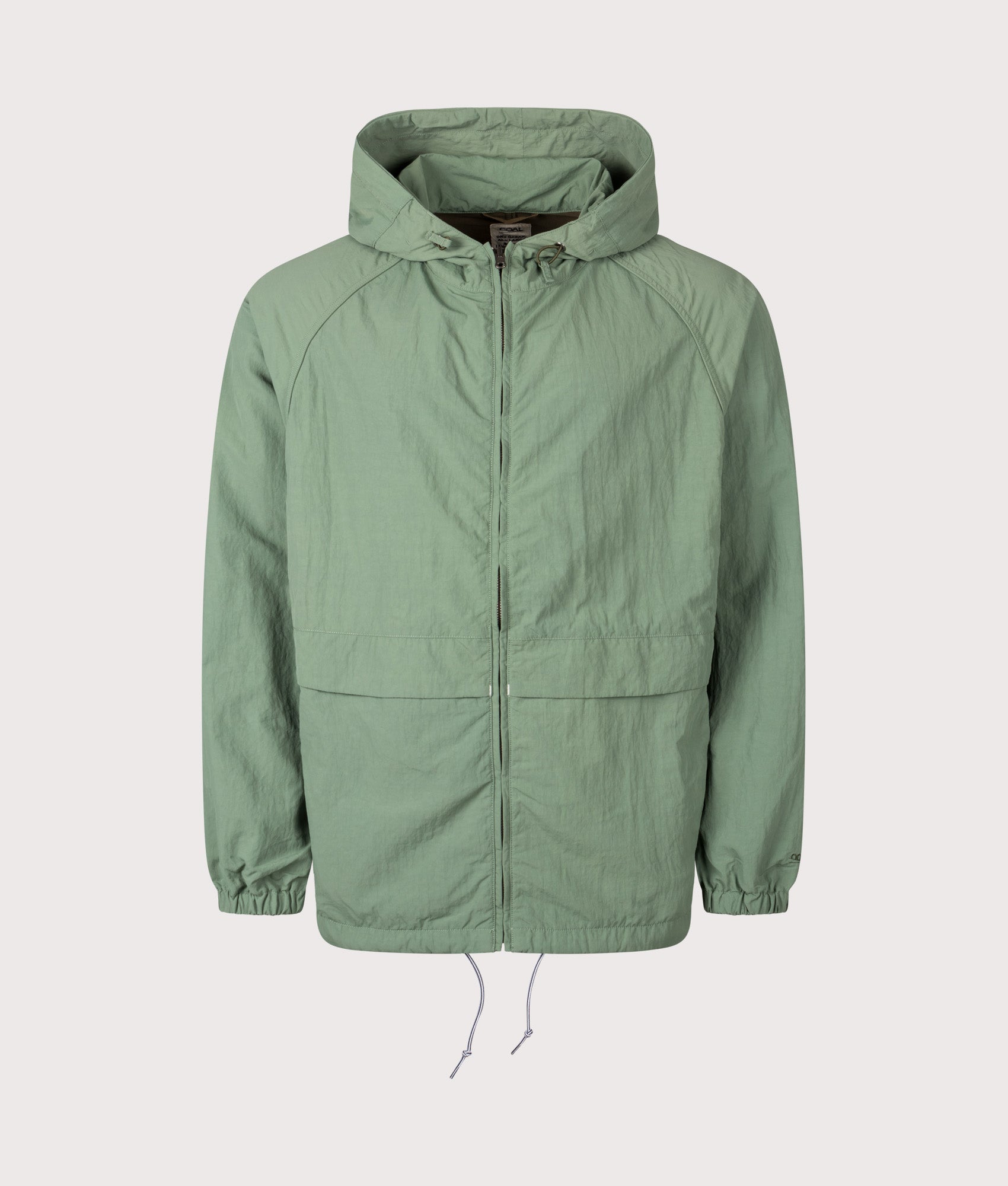 Nanamica Reversible Hooded Jacket in Fade Green at EQVVS Menswear. Front shot. 