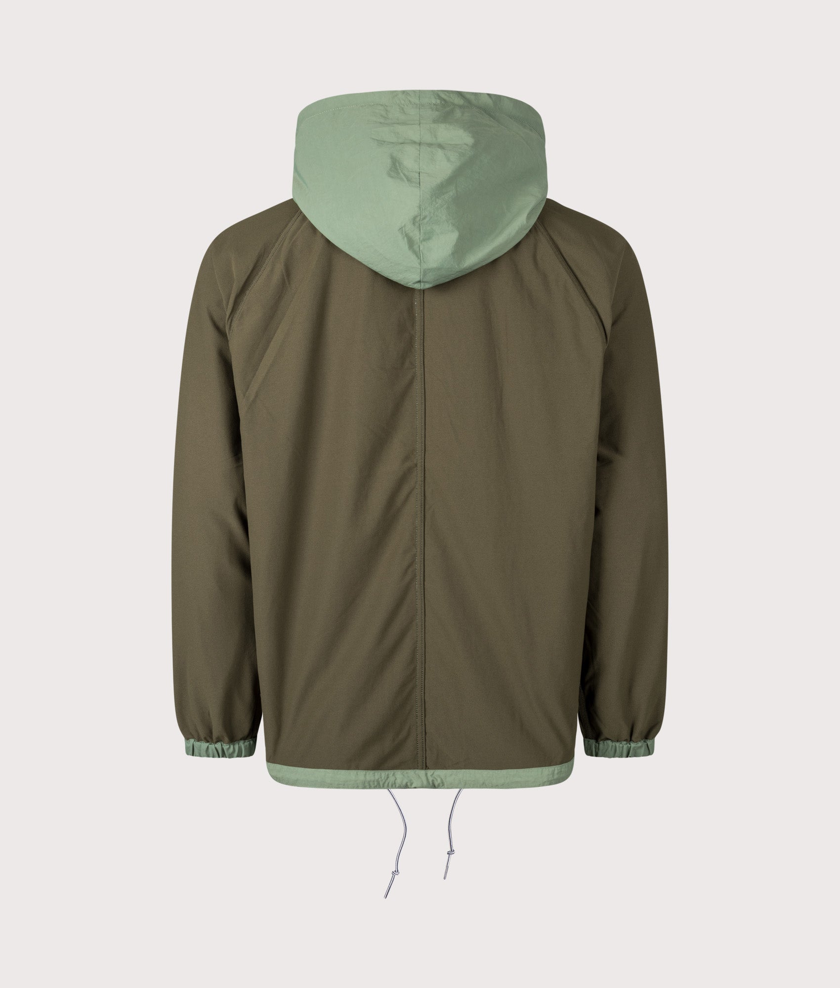 Nanamica Reversible Hooded Jacket in Fade Green at EQVVS Menswear. Alternate side back shot.