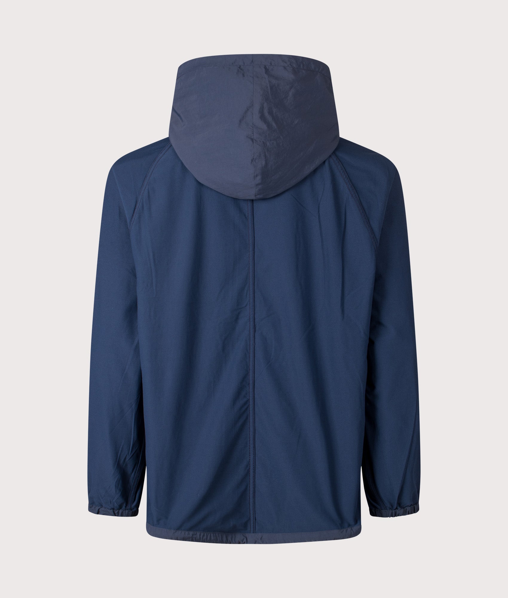 Nanamica Reversible Hooded Jacket in Navy at EQVVS Menswear. Alternate side back shot.